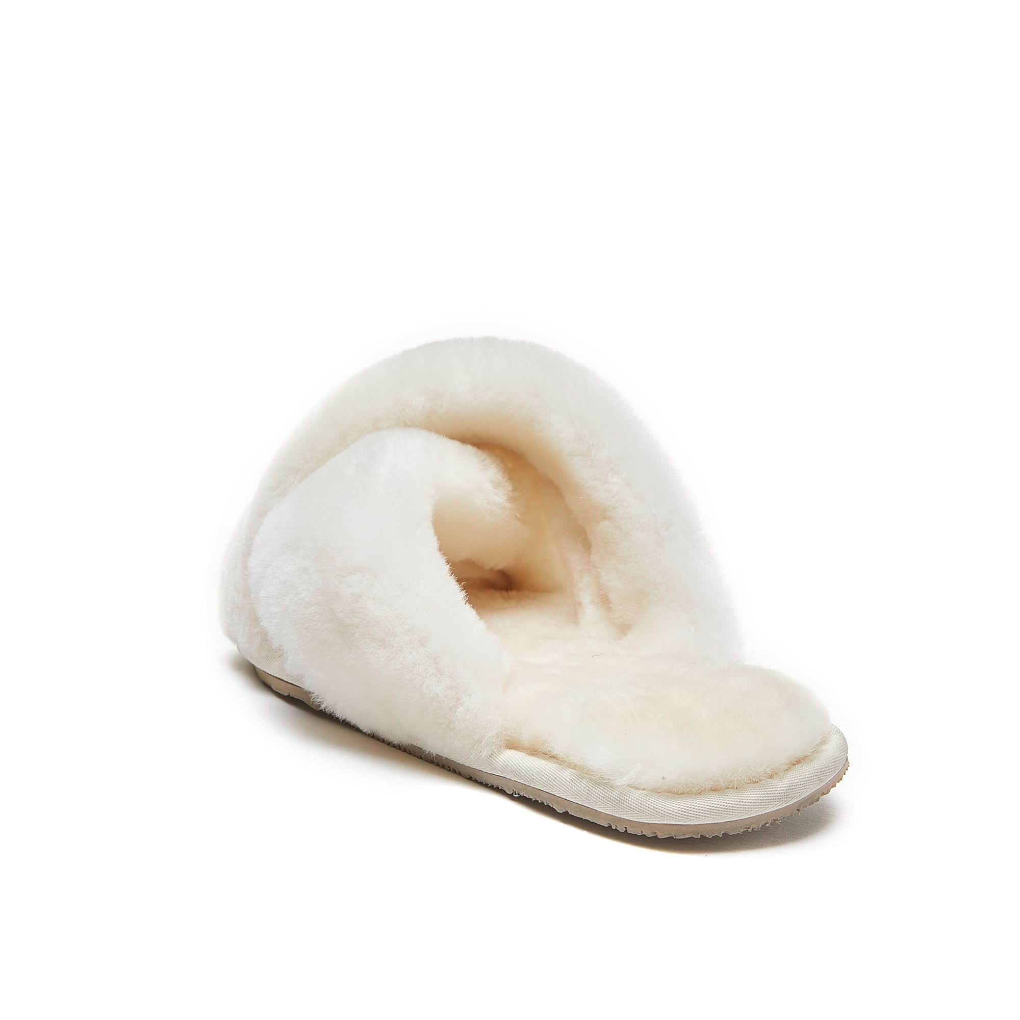 Cream sheepskin slipper with fluffy wool lining, side view on white background. - Yellow Earth Australia