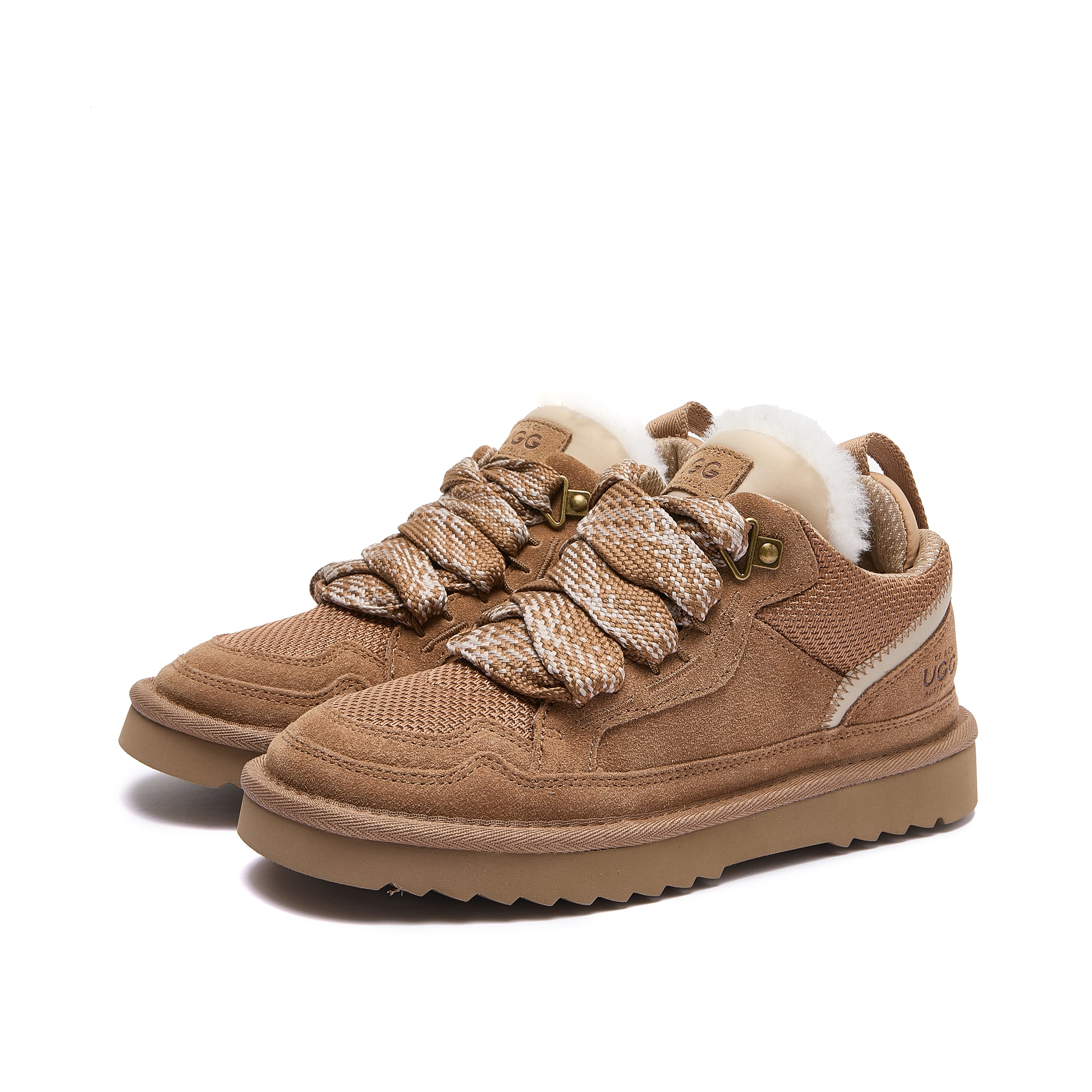 Leslie Chunky Sheepskin-Lined Sneaker in Chestnut - A pair of low-top brown suede and mesh sneakers with chunky knit laces, a white wool lining, and a thick brown sole, shown on a plain white background.