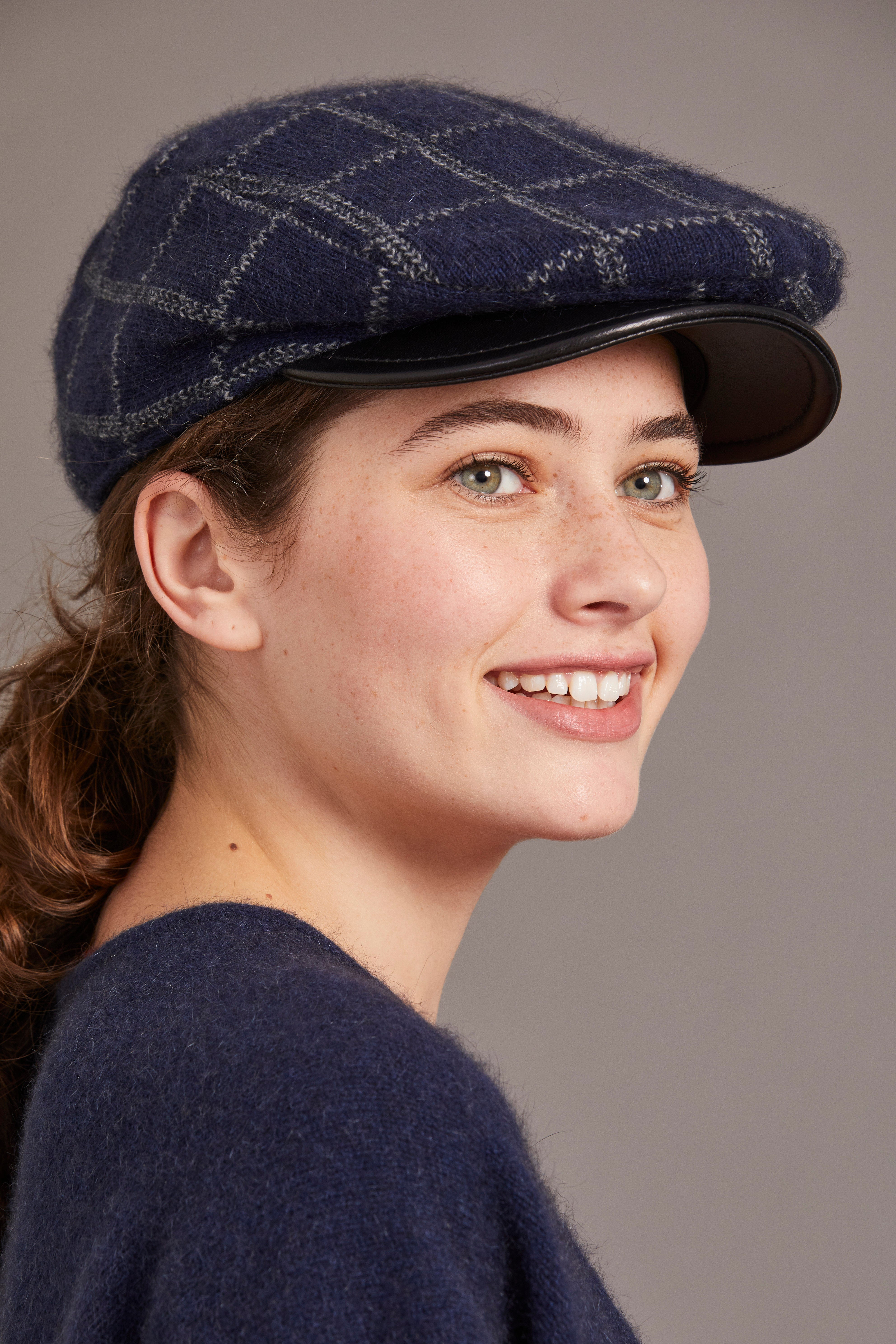 Navy wool flat cap with quilted pattern and leather peak, side view. - Yellow Earth Australia