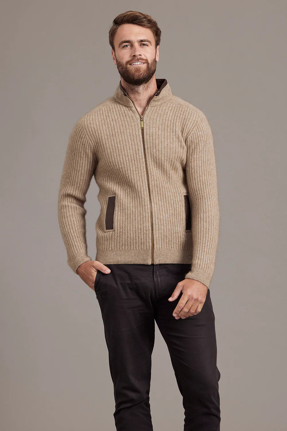 Beige ribbed wool zip cardigan with brown accents, front view on male model. - Yellow Earth Australia