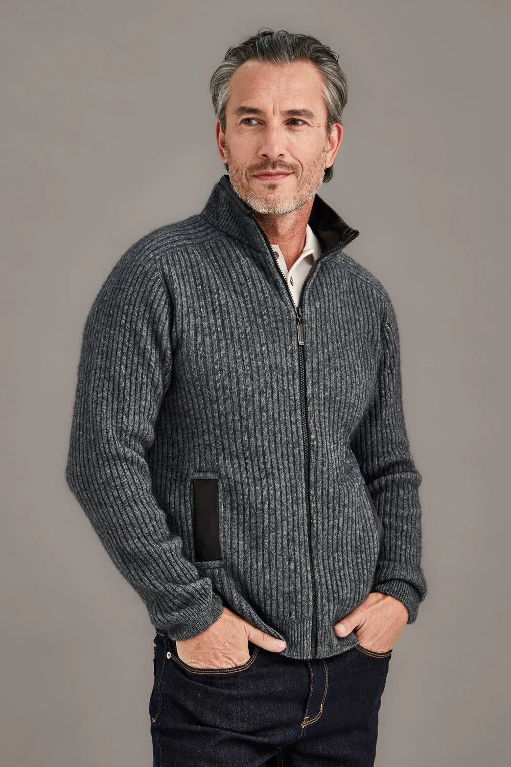 Grey ribbed wool zip-up cardigan with black trim worn by man, front view. - Yellow Earth Australia