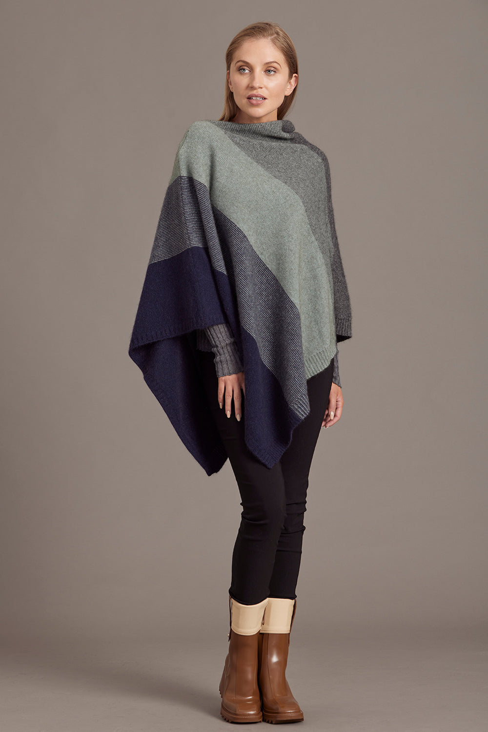 Colour-block wool poncho in grey, charcoal and navy, displayed on model from front angle. - Yellow Earth Australia