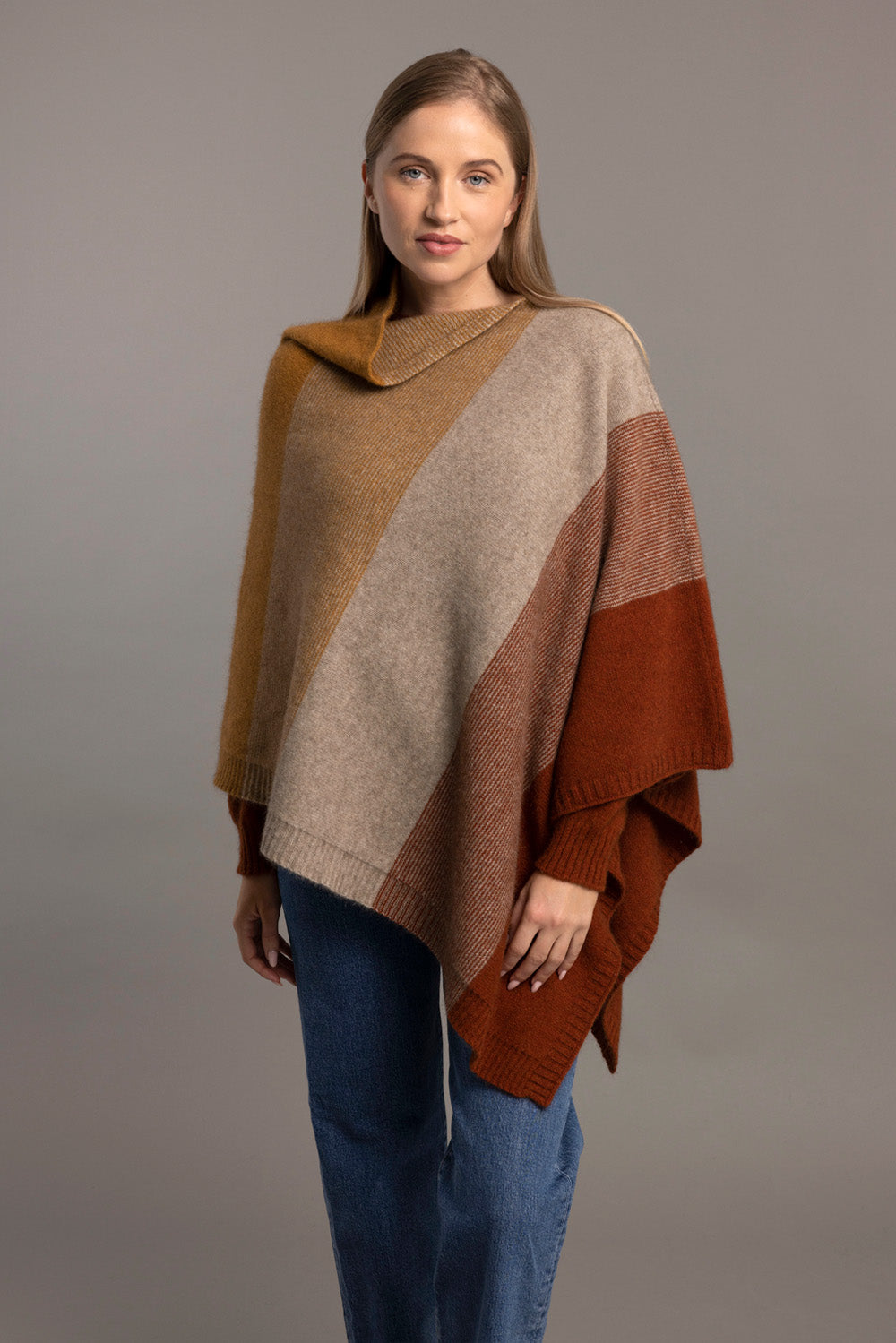 Colorblock wool poncho in rust, camel and cream with ribbed texture, front view. - Yellow Earth Australia