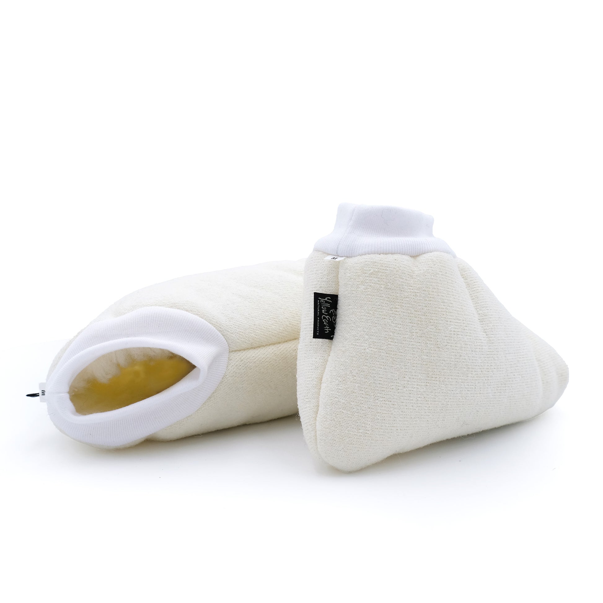 Cream wool booties with white ribbed cuffs and gel insert, displayed from side angle. - Yellow Earth Australia