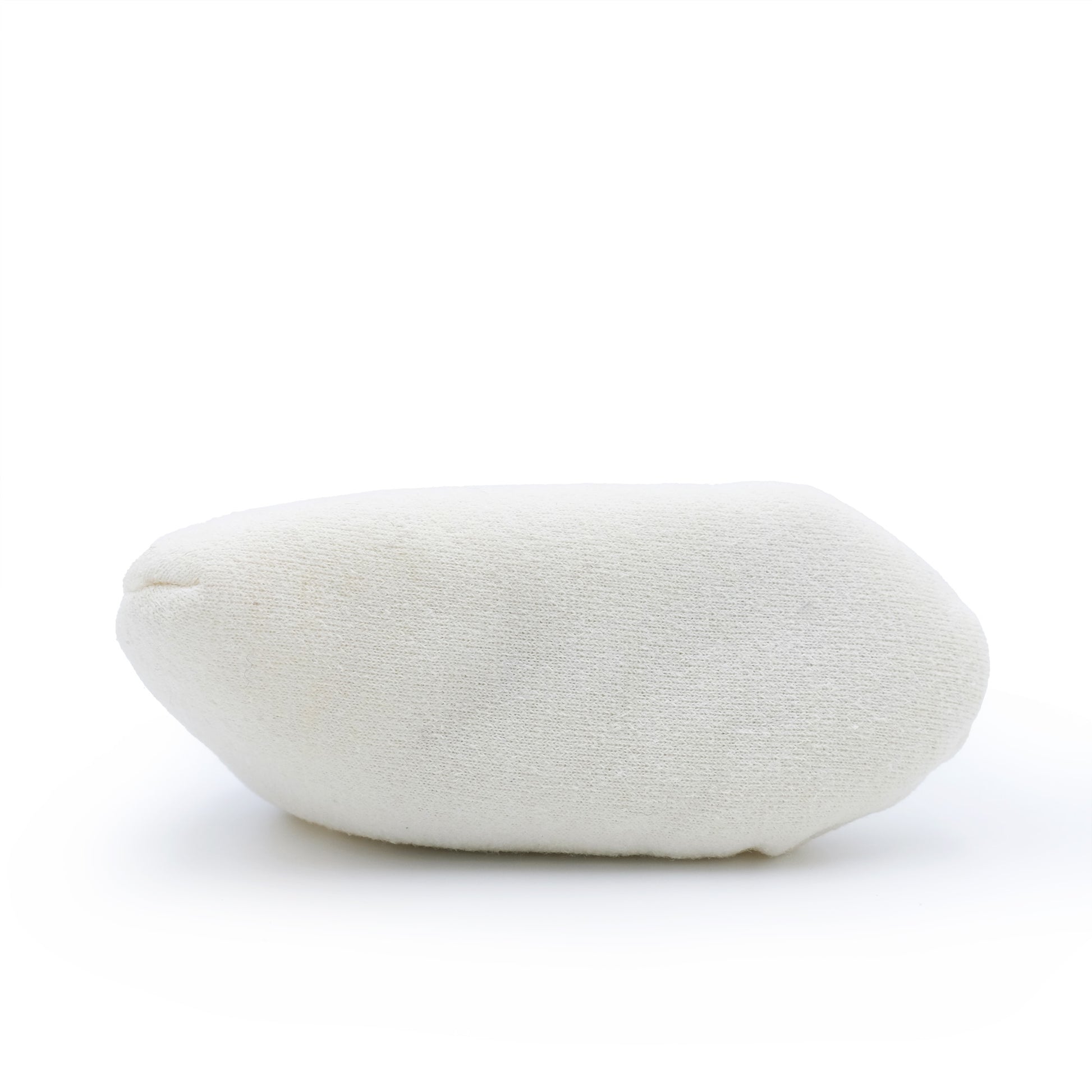 White sheepskin pouffe with soft wool texture, angled side view. - Yellow Earth Australia
