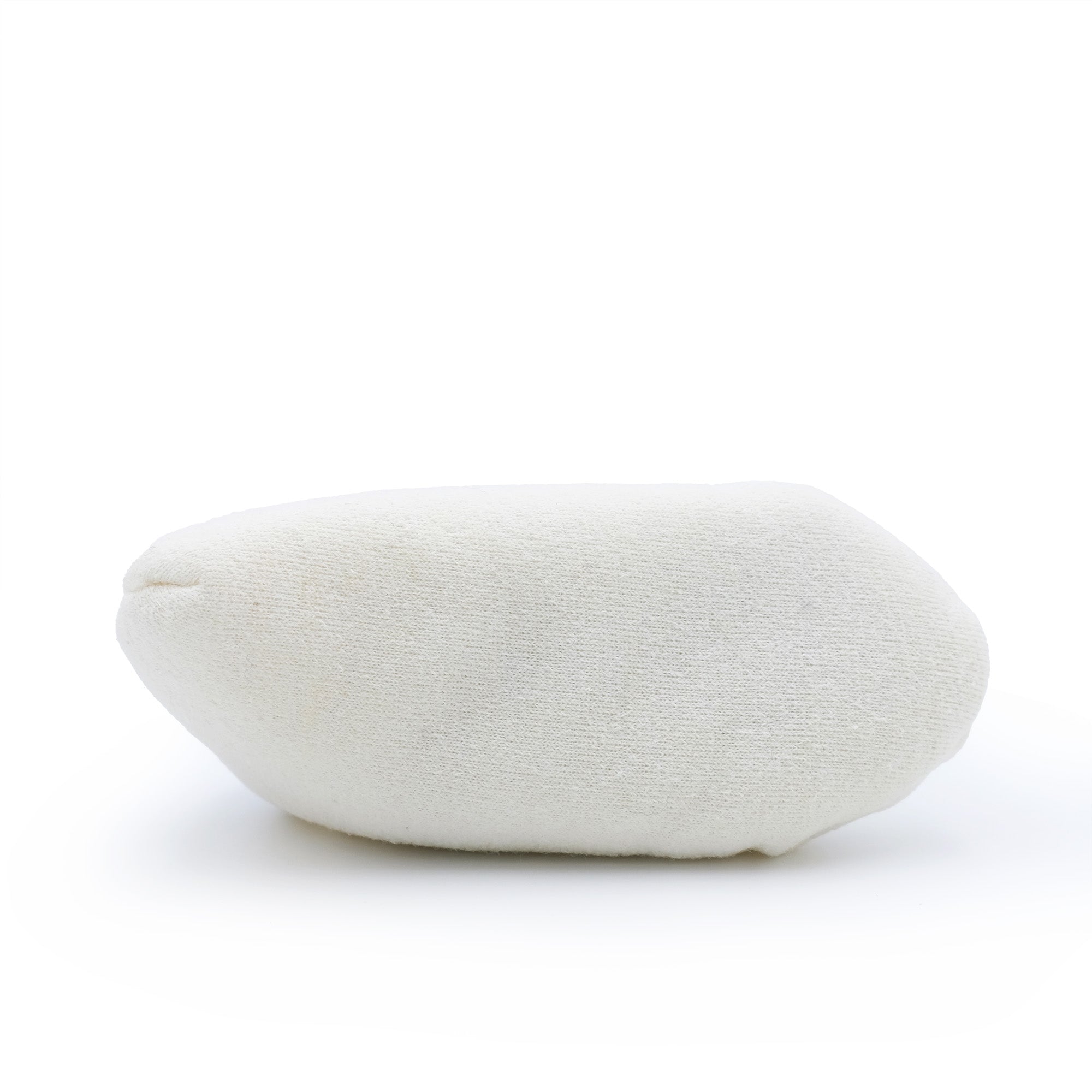 White sheepskin pouffe with soft wool texture, angled side view. - Yellow Earth Australia