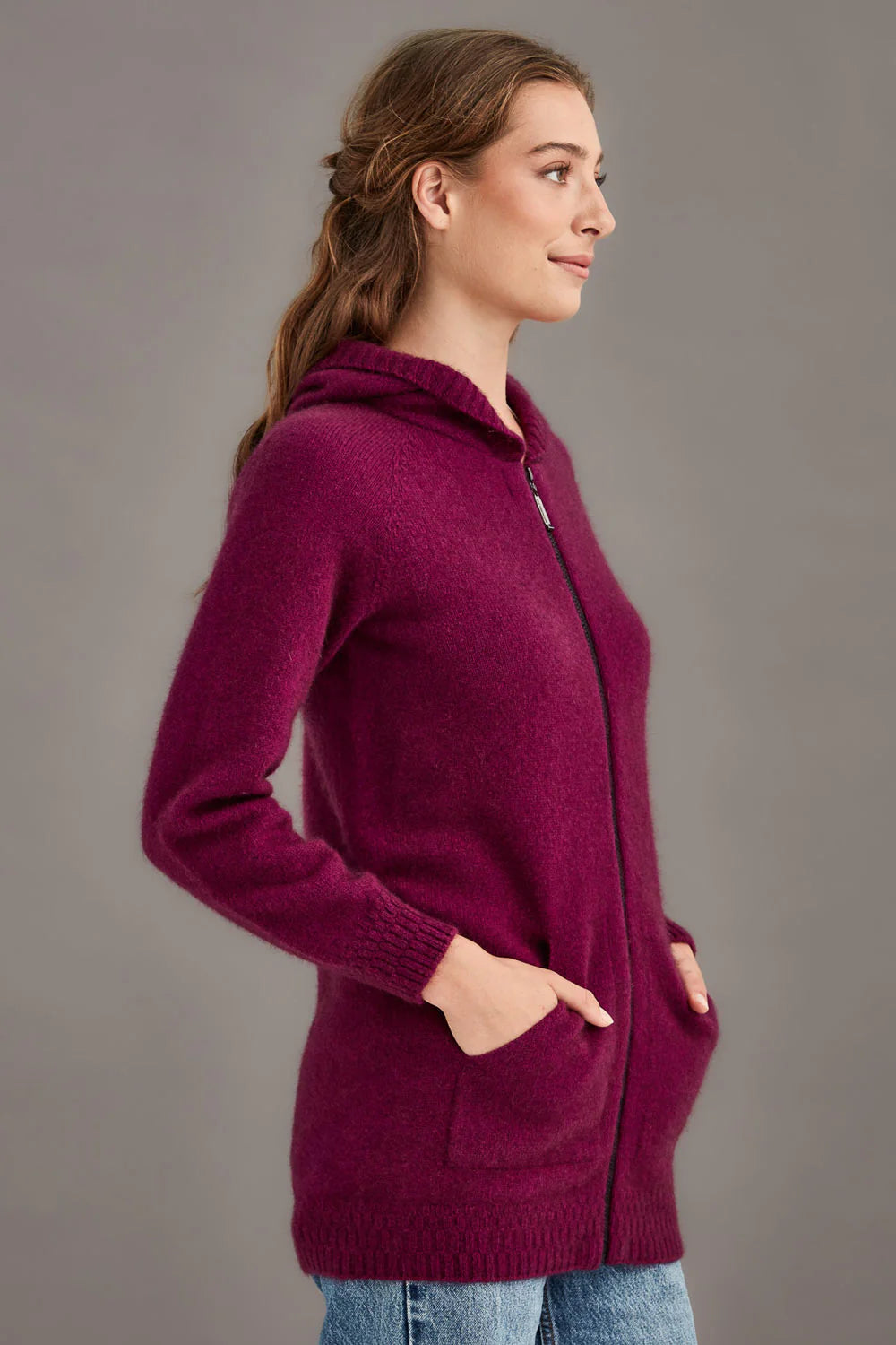 Burgundy wool hooded cardigan with front pockets, shown from the side profile view. - Yellow Earth Australia