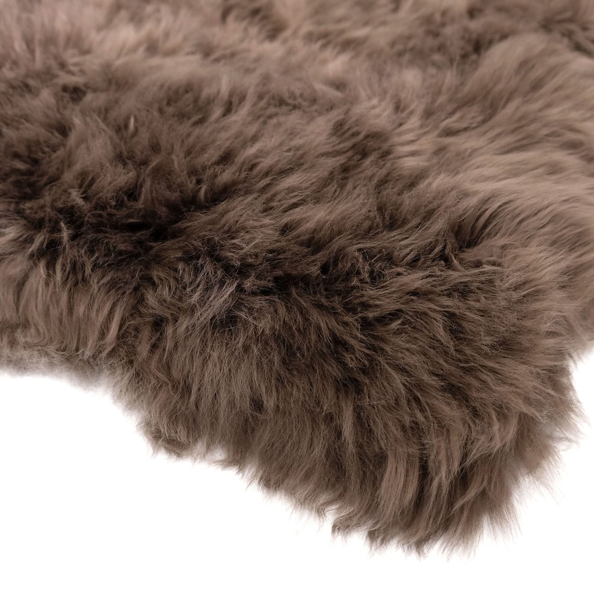 Taupe sheepskin rug with thick wool pile, close-up top view showing soft texture. - Yellow Earth Australia