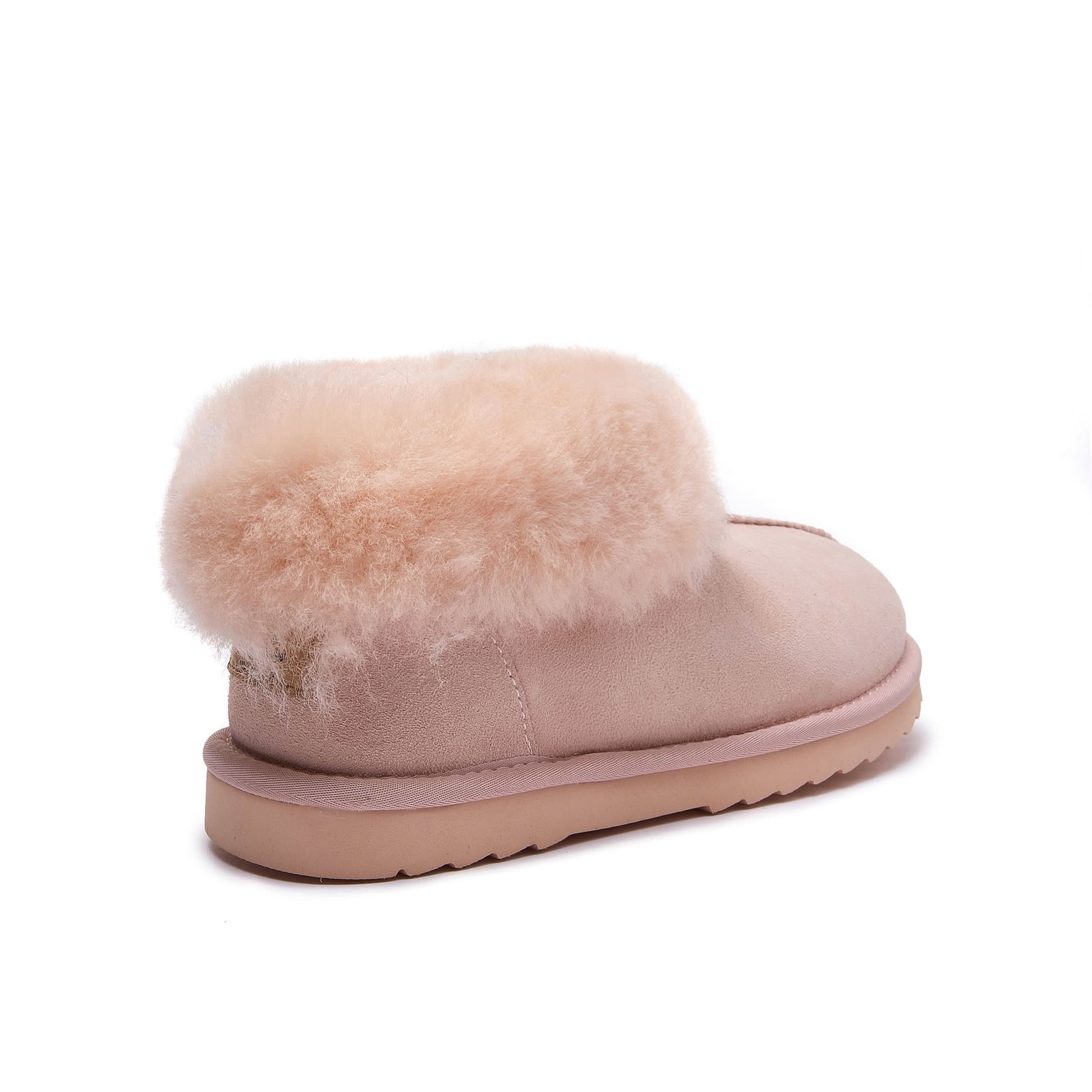 Soft pink sheepskin slipper boot with fluffy wool cuff, side view. - Yellow Earth Australia