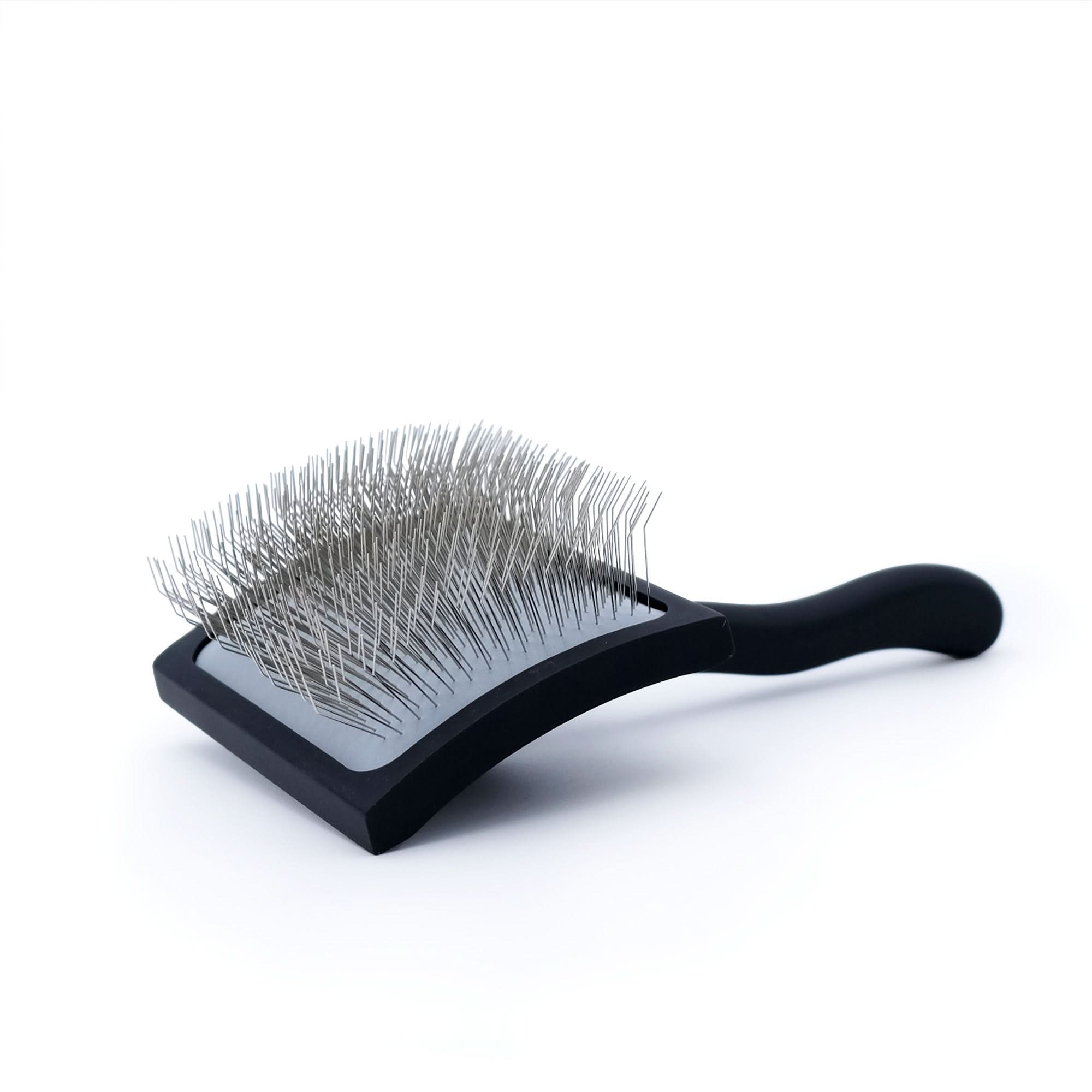 Black paddle brush with wire bristles for grooming wool and sheepskin products. - Yellow Earth Australia
