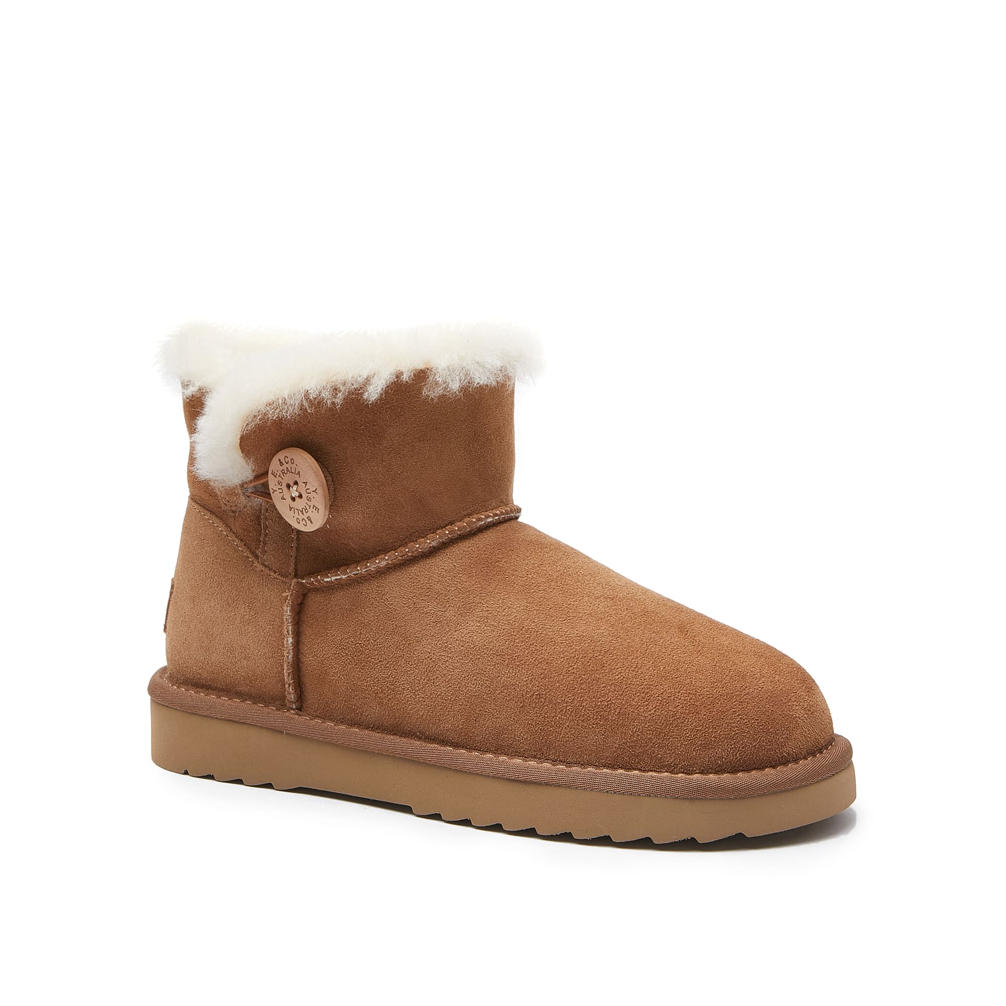 Chestnut sheepskin mini boot with white fur trim and decorative button, side view. - Yellow Earth Australia