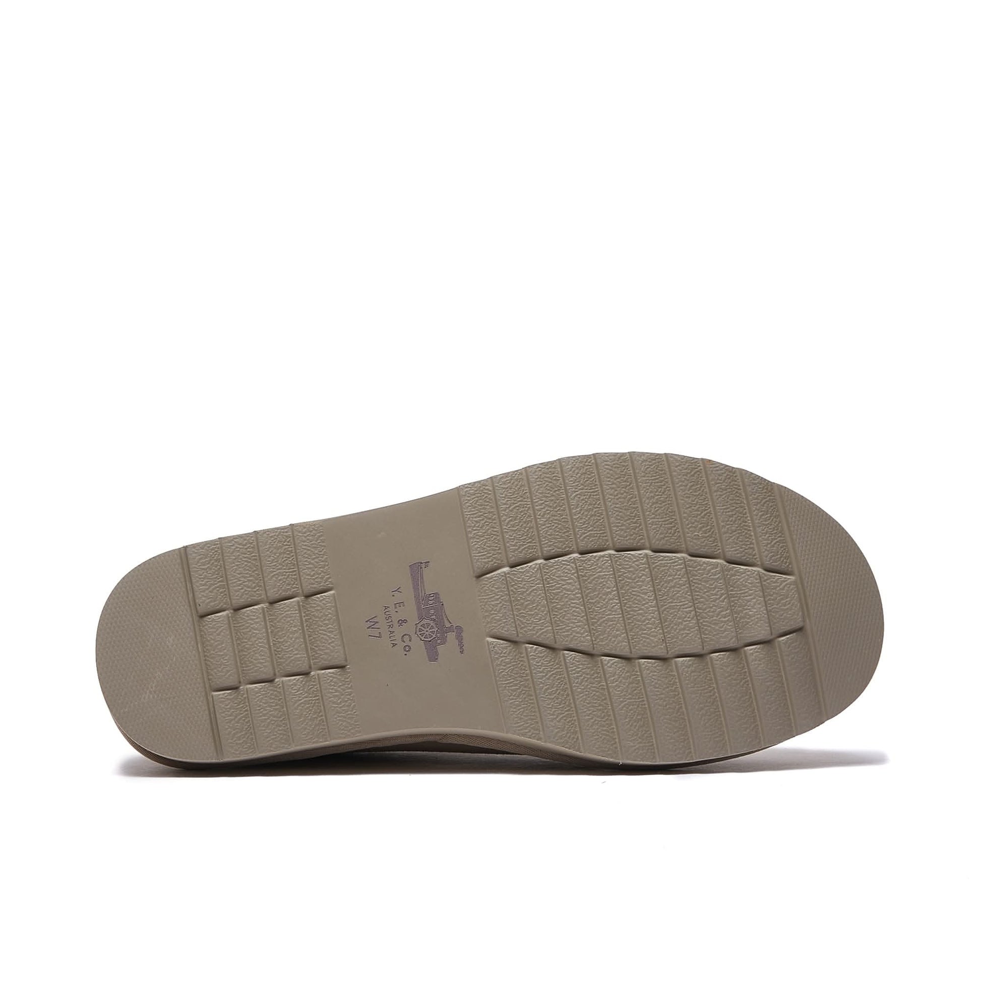 Beige sheepskin slip-on shoe sole showing textured rubber bottom view. - Yellow Earth Australia