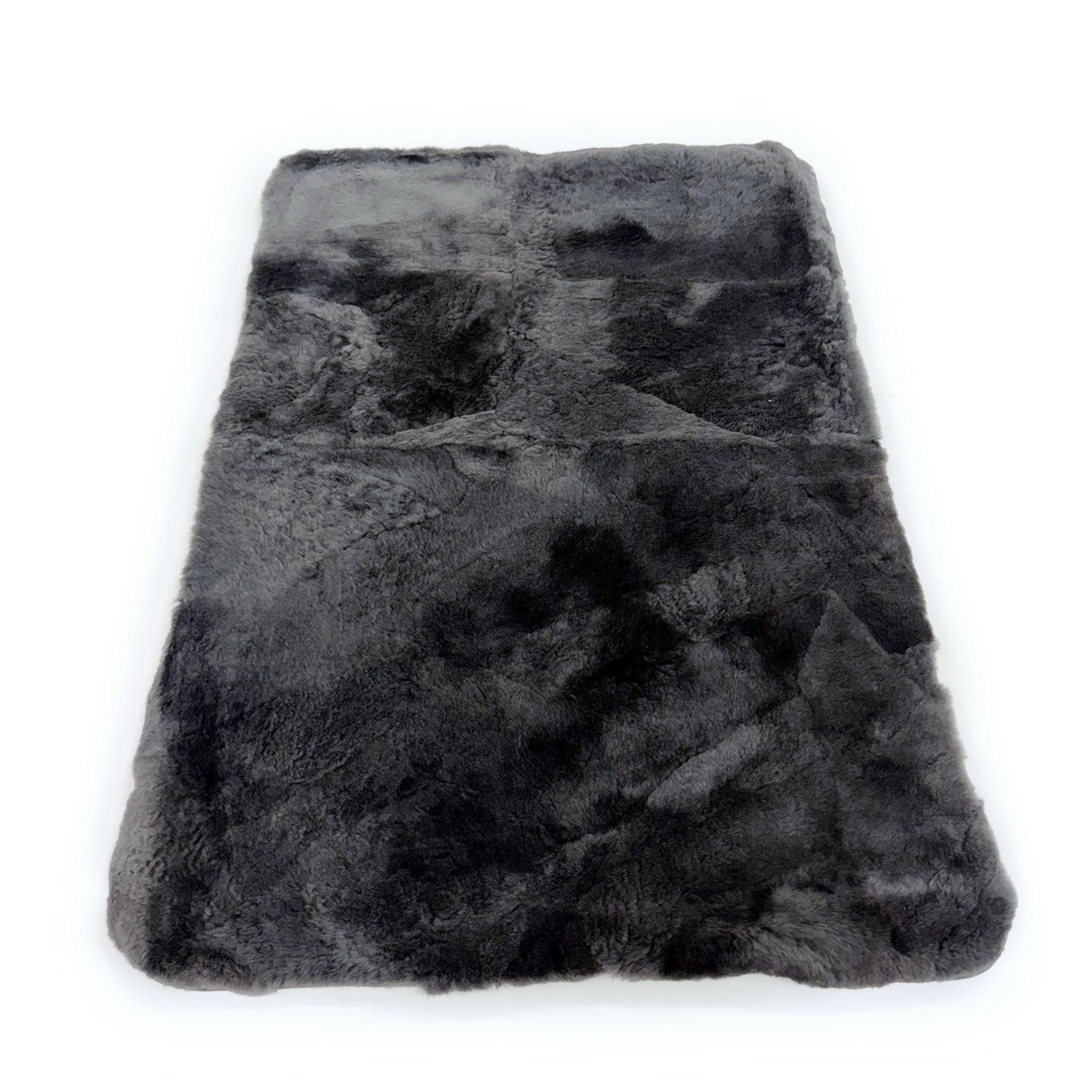 Grey sheepskin rug with natural wool texture, overhead view. - Yellow Earth Australia