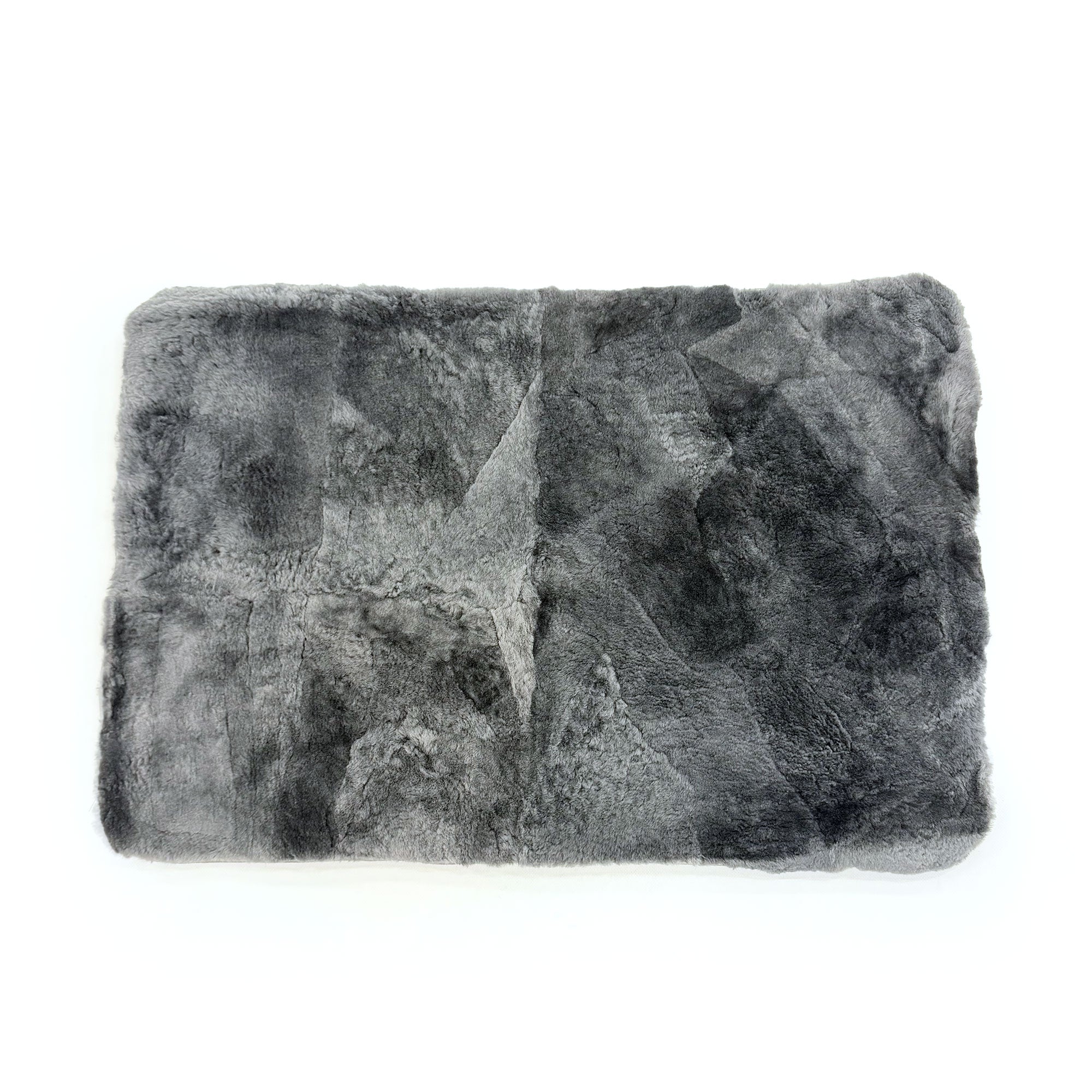 Grey sheepskin rug with soft wool texture displayed from above on white background. - Yellow Earth Australia