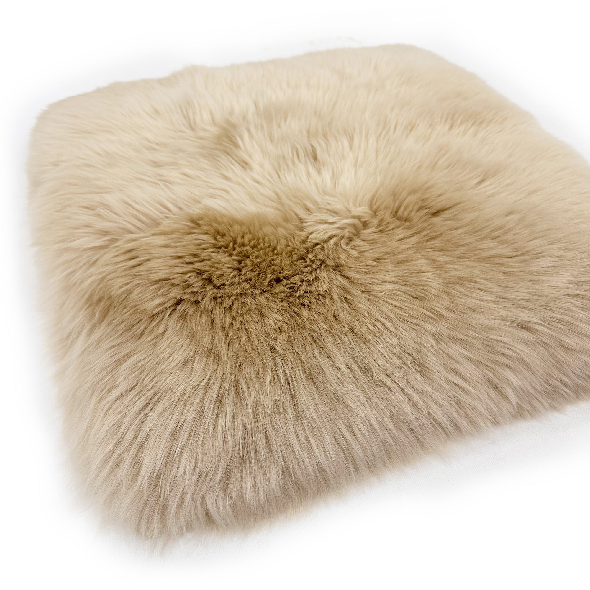 Cream sheepskin cushion cover with gathered centre detail, top view. - Yellow Earth Australia