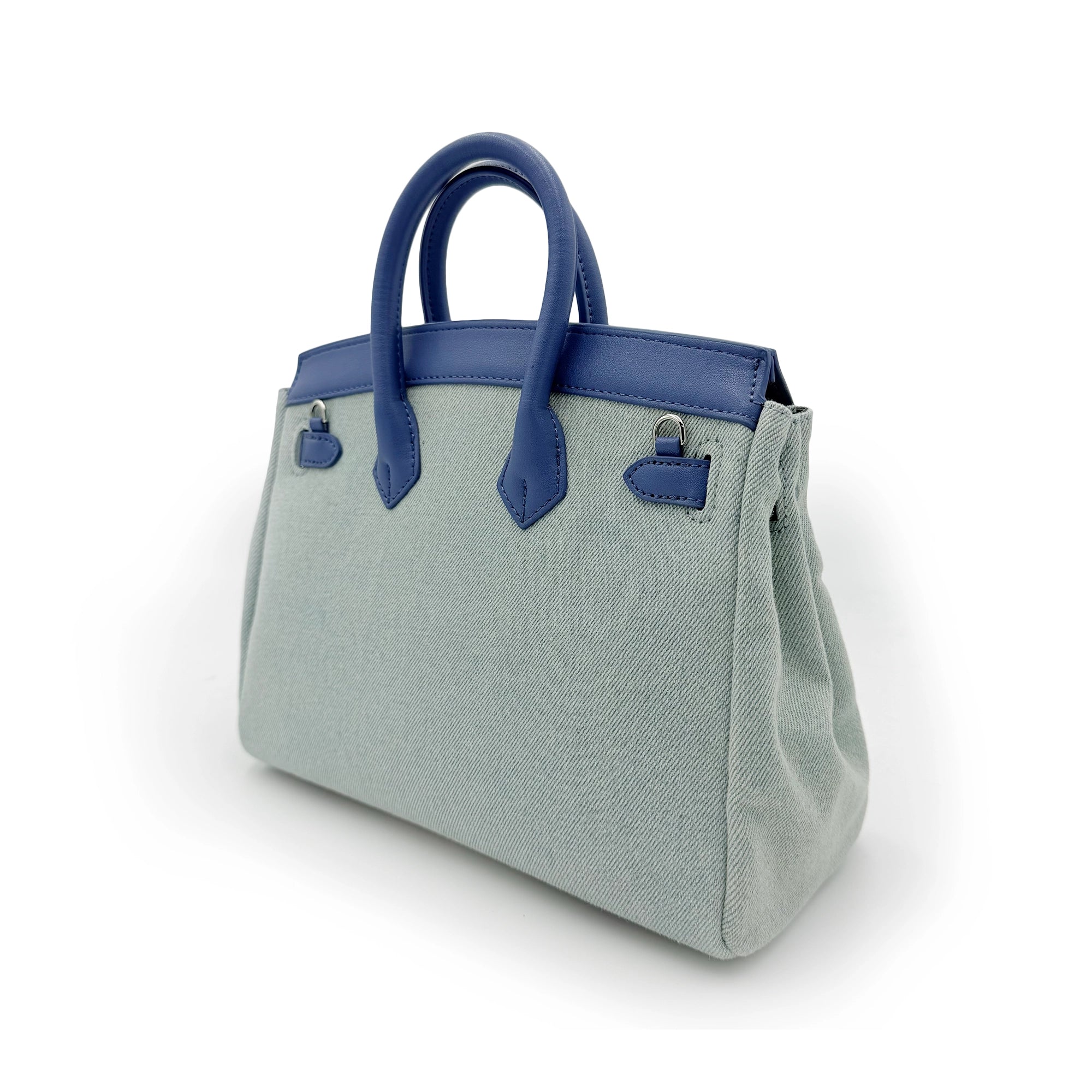 Light grey wool handbag with navy blue leather handles and trim, shown from side angle. - Yellow Earth Australia