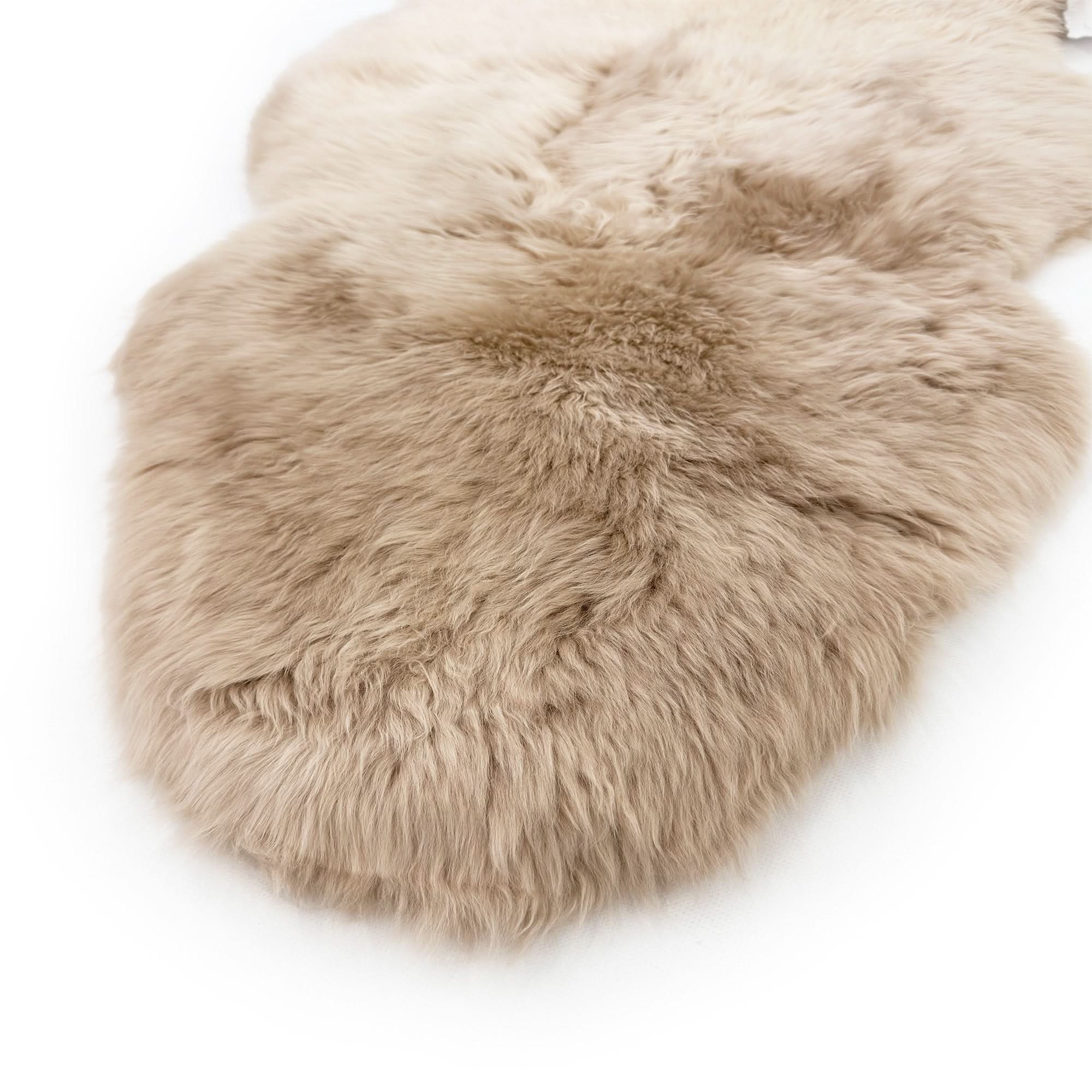 Sheepskin rug in cream with natural wool texture, overhead view. - Yellow Earth Australia