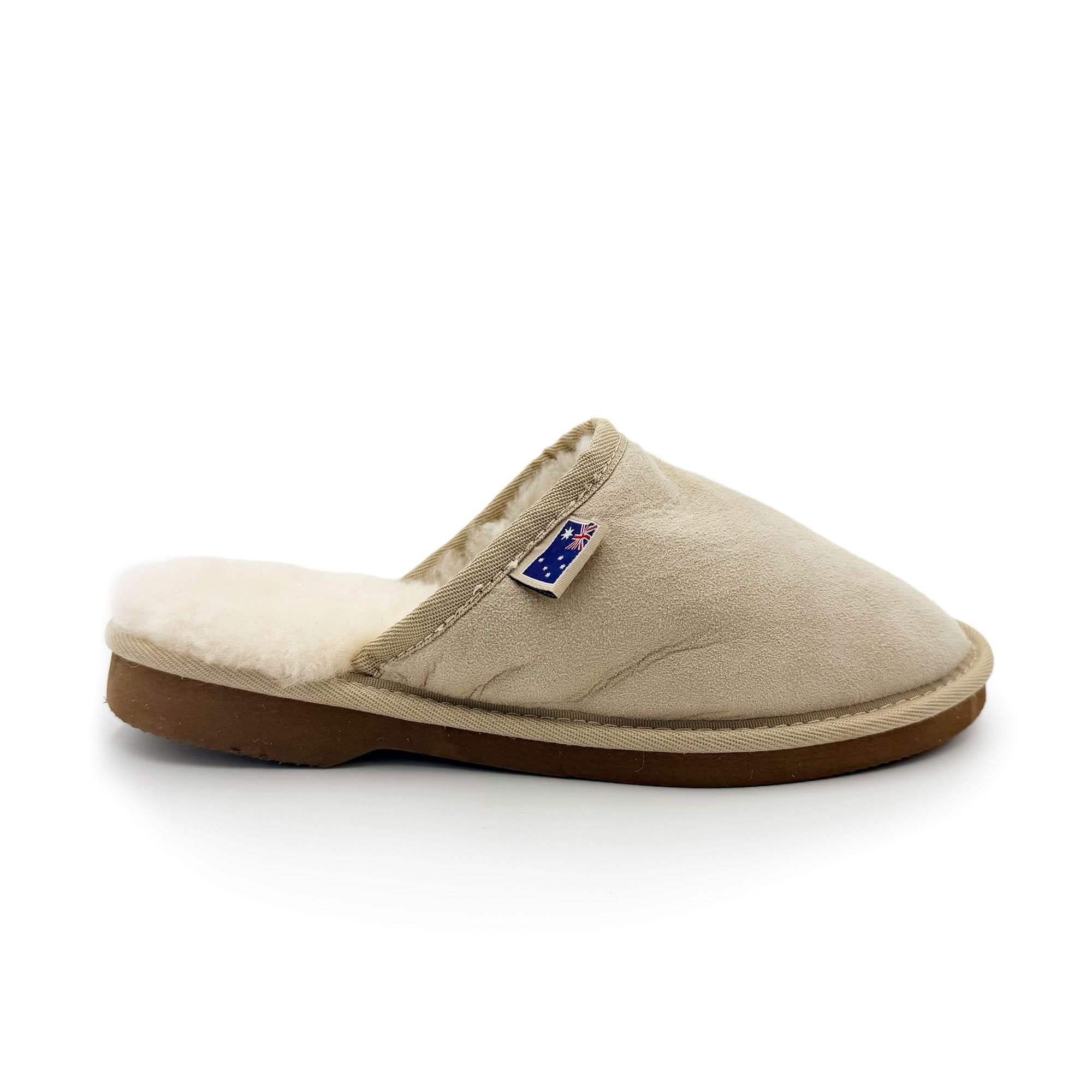 Beige sheepskin slipper with wool lining, side view against white background. - Yellow Earth Australia