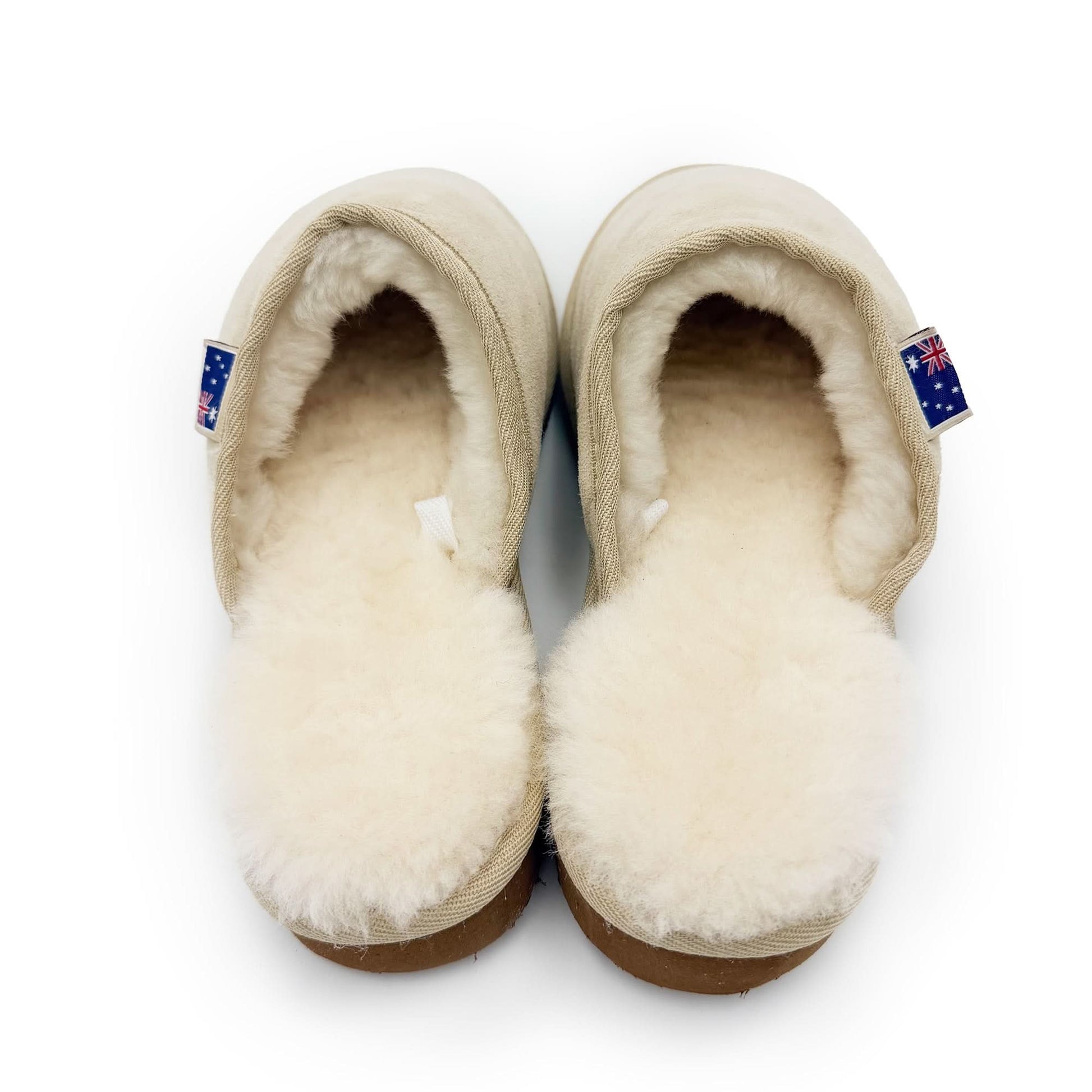 Cream sheepskin slippers with wool lining viewed from above on white background. - Yellow Earth Australia