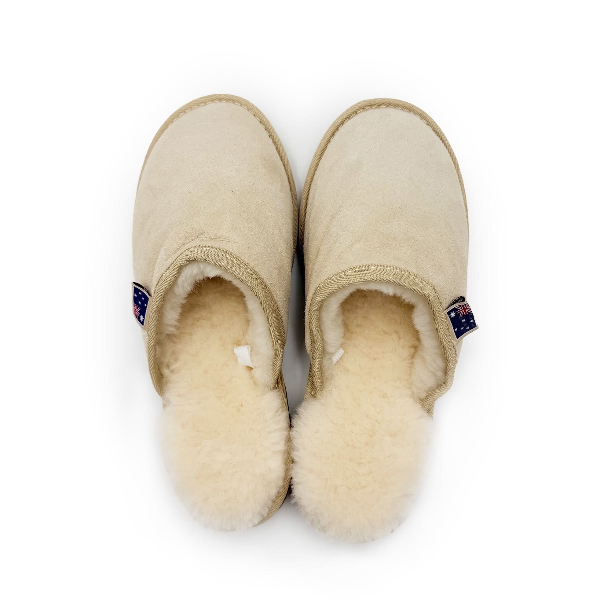 Cream sheepskin wool slip-on boots with fluffy lining, top-down view. - Yellow Earth Australia