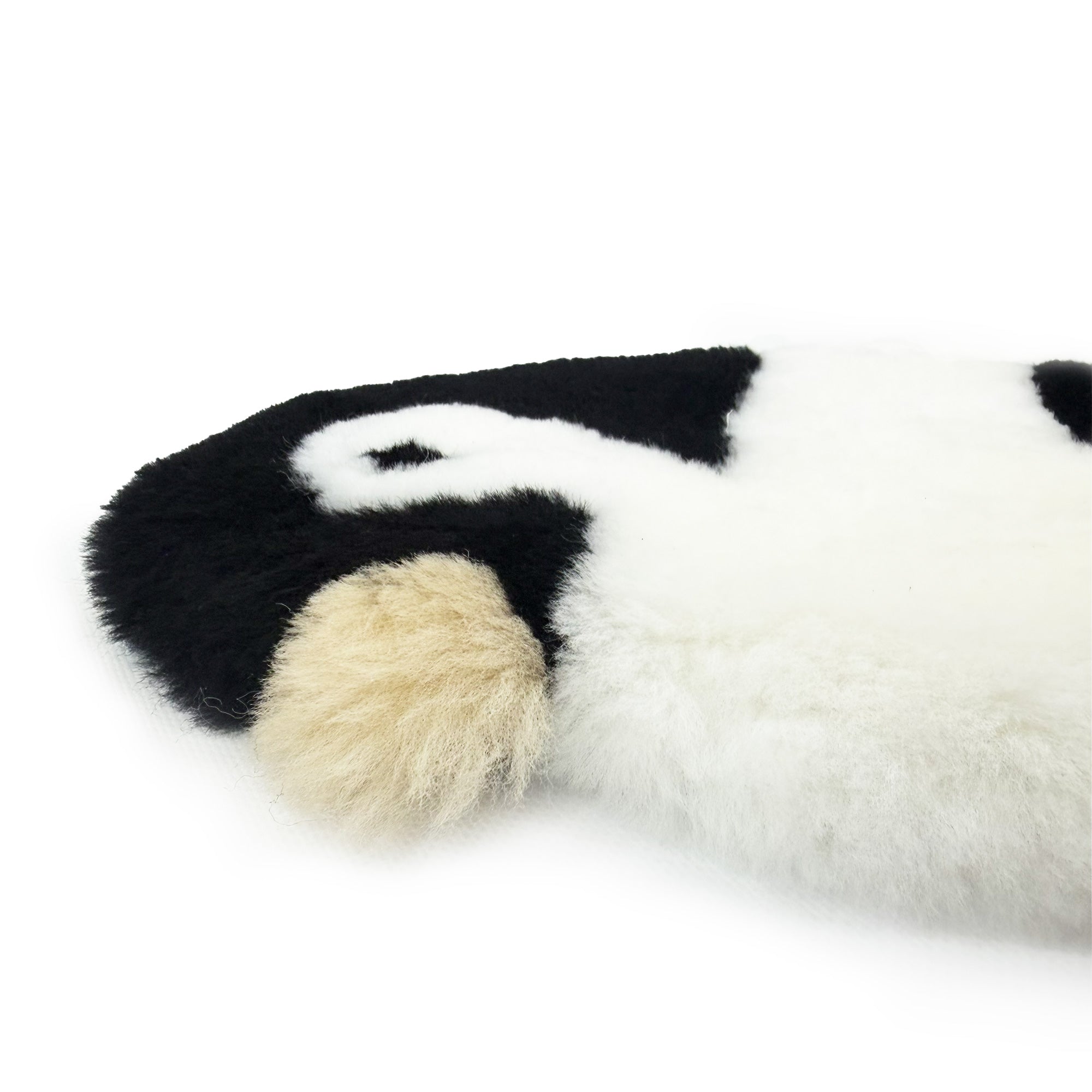 Soft wool sheepskin rug in black, white and cream tones, top view. - Yellow Earth Australia