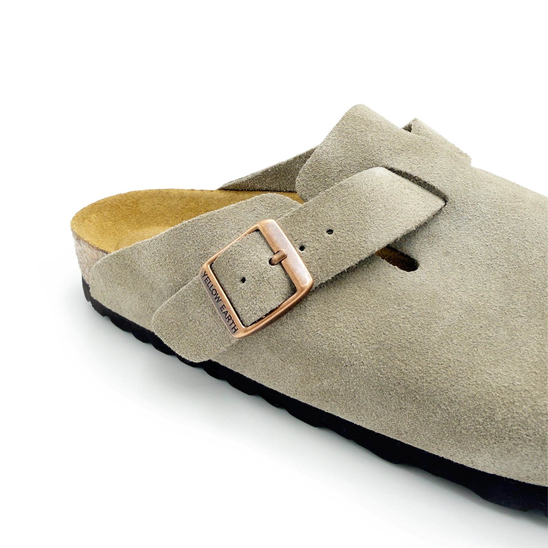 Beige suede clog with buckle strap, angled side view showing sheepskin lining and black sole. - Yellow Earth Australia