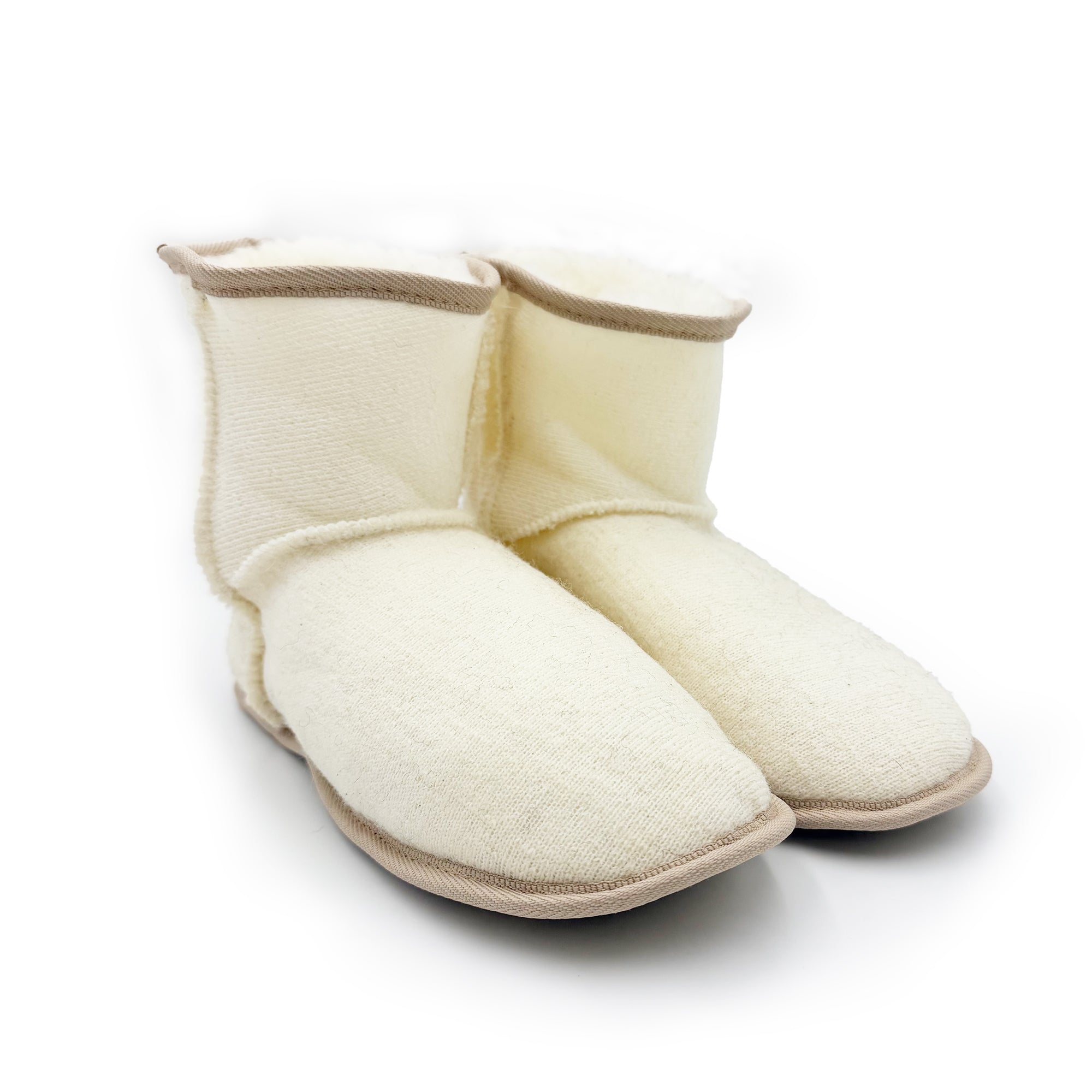 Cream wool bootie slippers with sheepskin lining, three-quarter front view. - Yellow Earth Australia