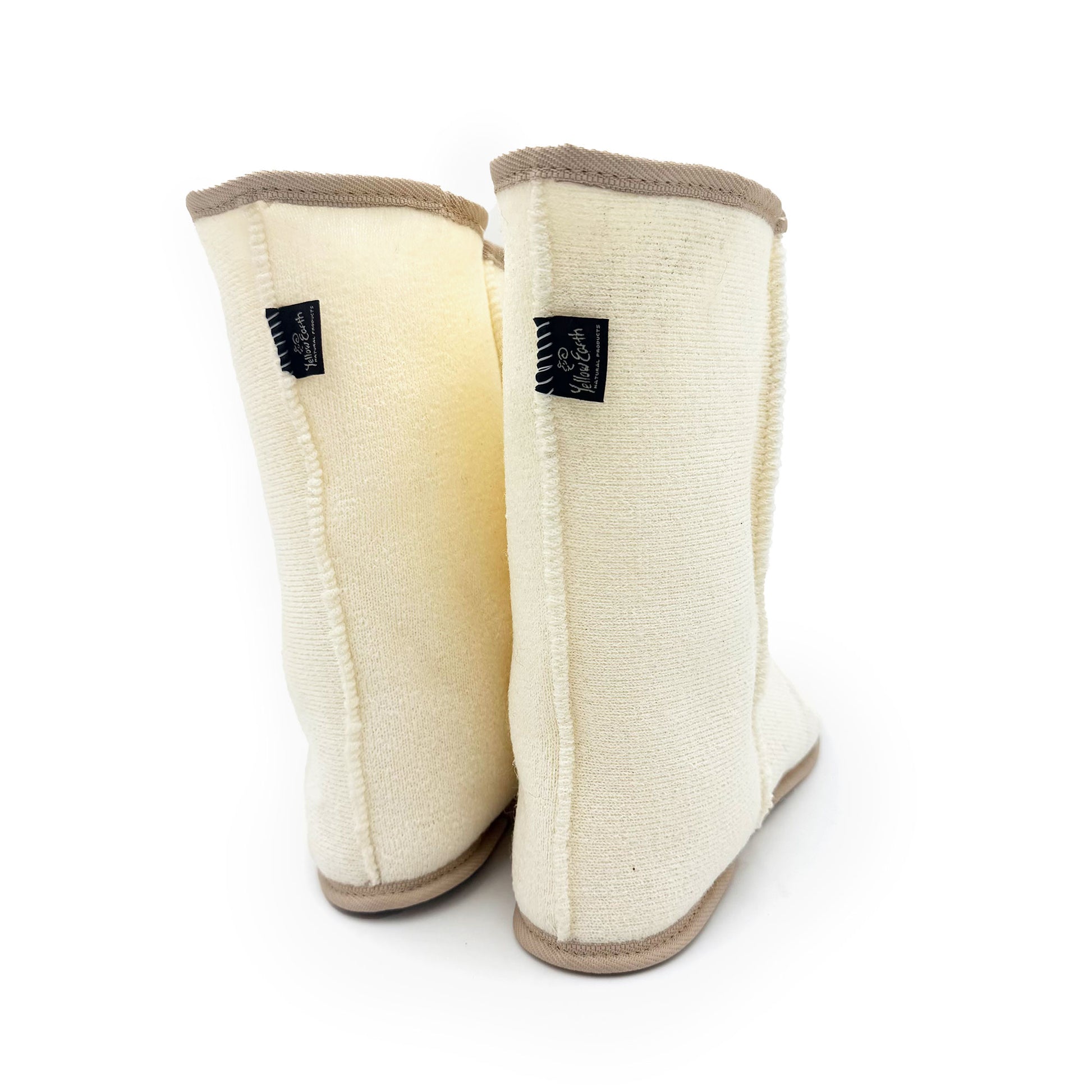 Cream wool leg warmers with tan trim, displayed side-by-side on white background. - Yellow Earth Australia