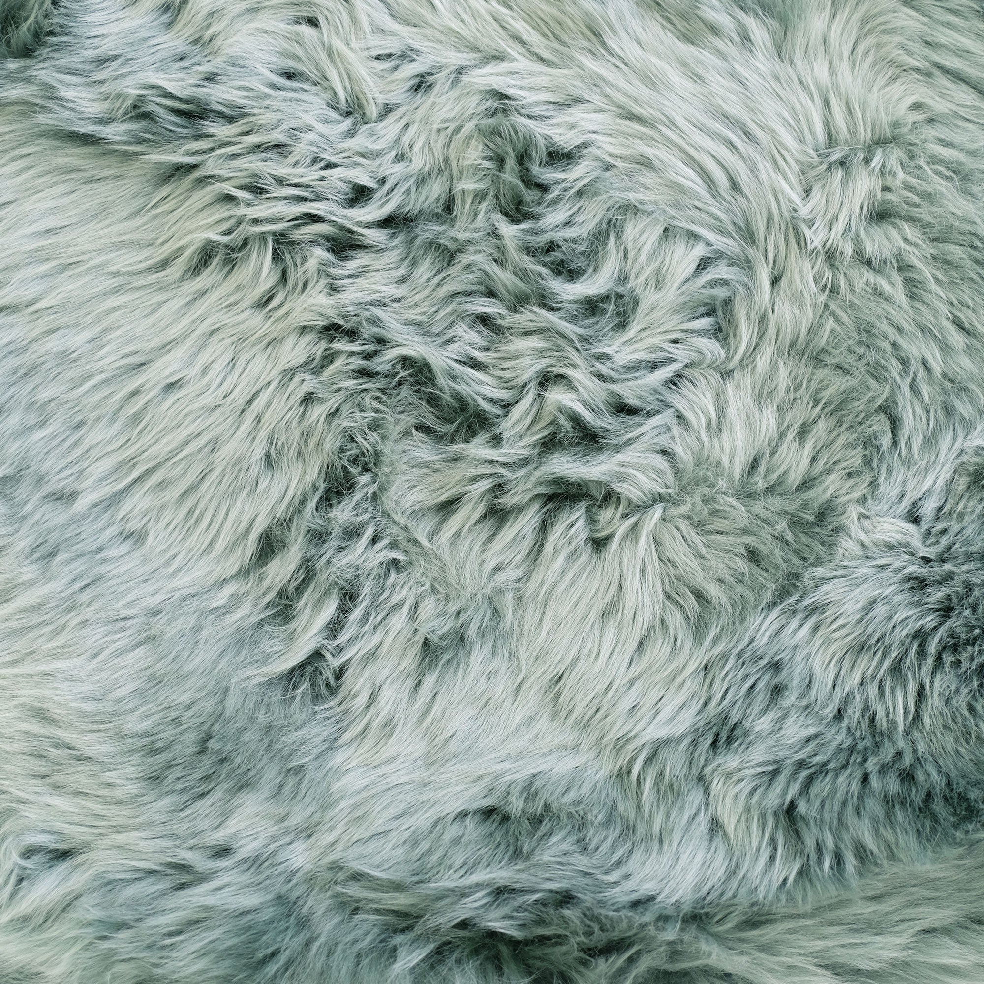 Soft grey sheepskin rug with natural wool texture viewed from above. - Yellow Earth Australia