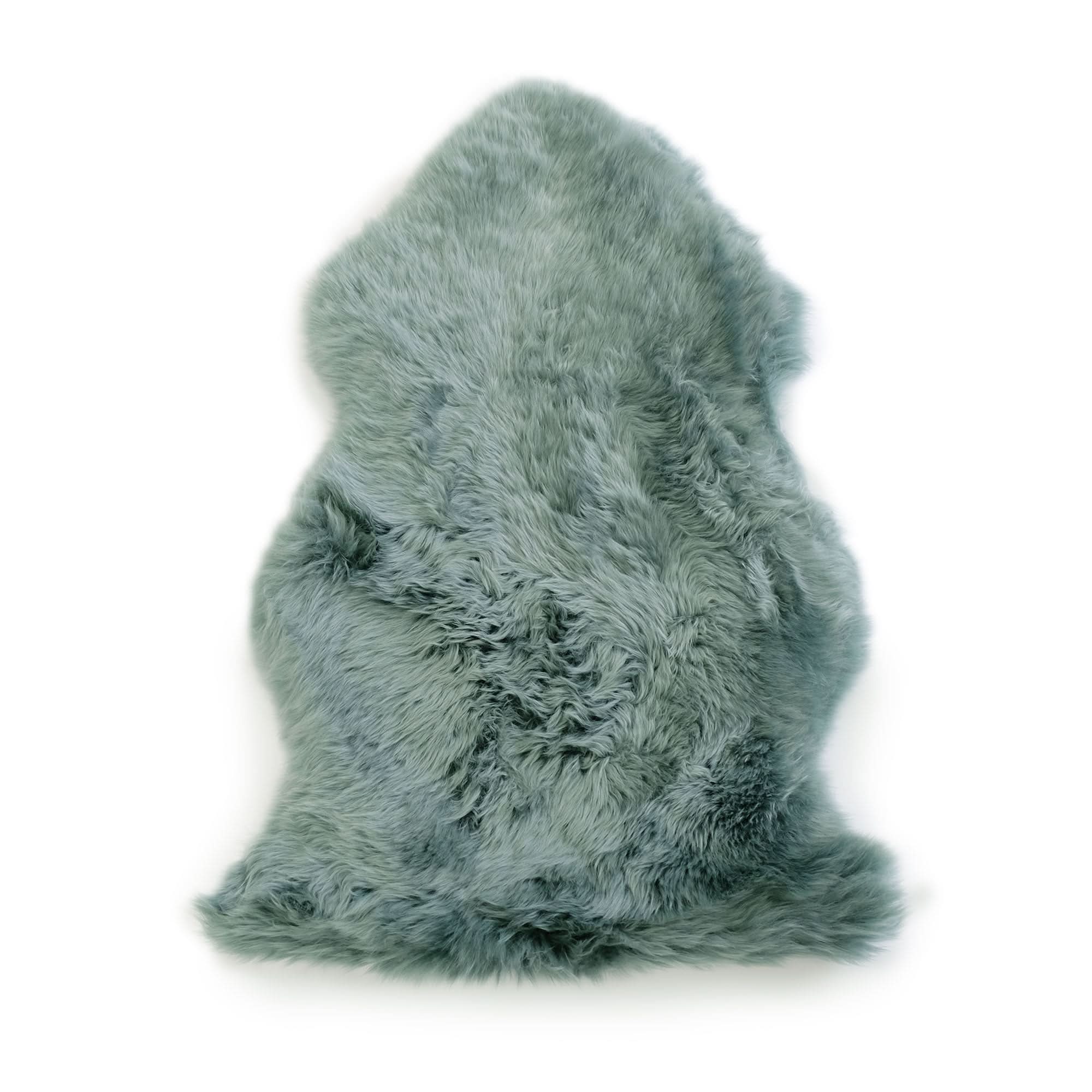 Soft sage green sheepskin rug viewed from above showing luxurious wool texture. - Yellow Earth Australia