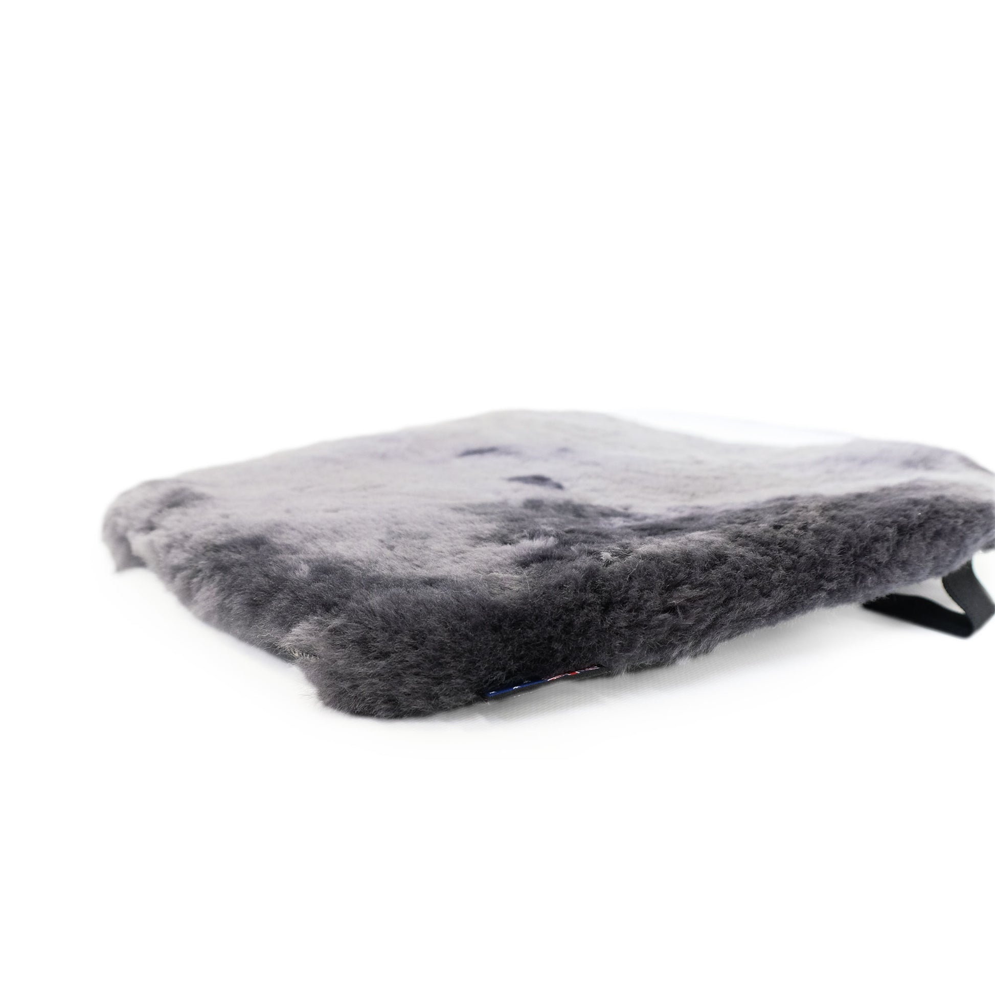 Grey sheepskin seat cushion with soft wool texture, angled side view. - Yellow Earth Australia