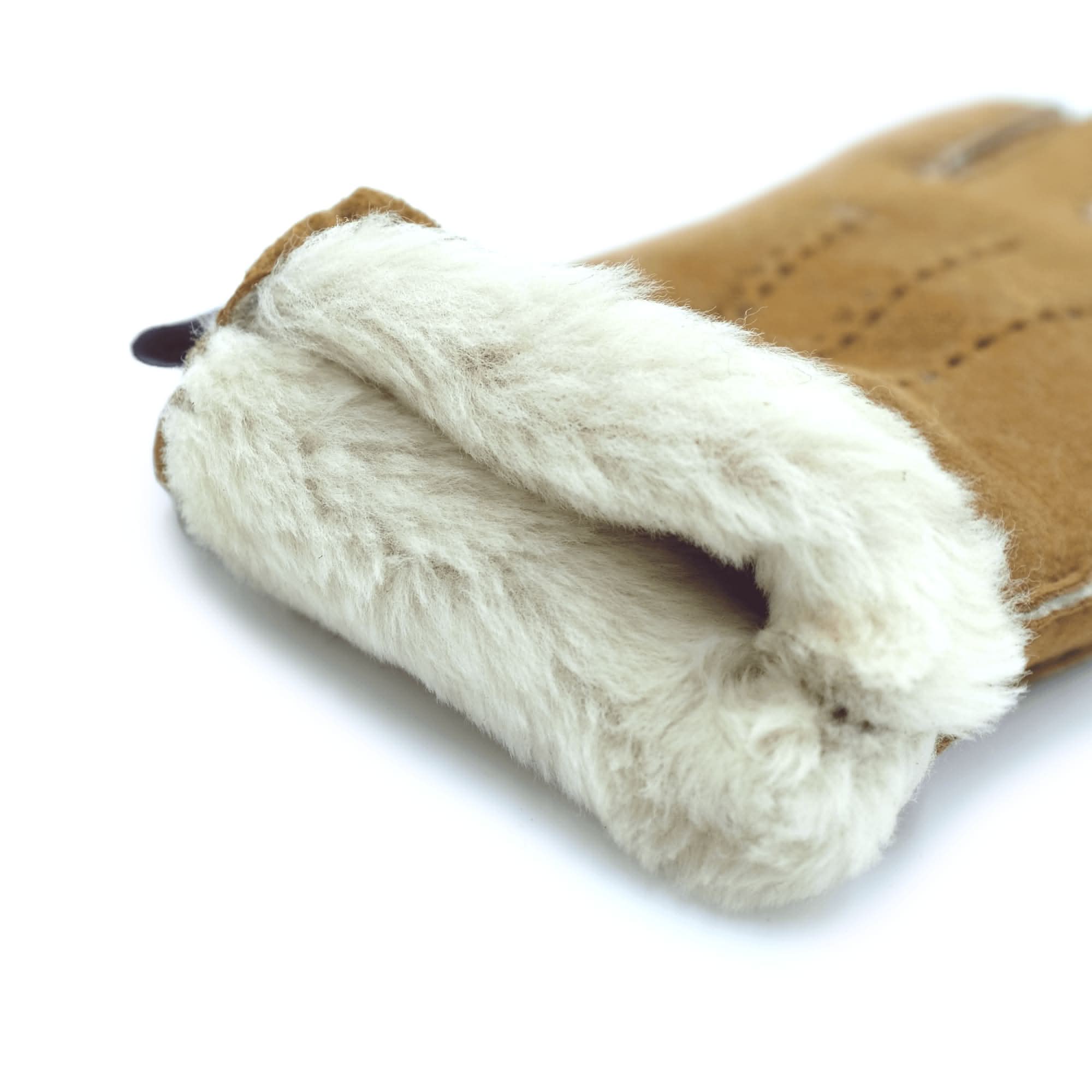 Soft sheepskin and wool slipper in tan and cream, viewed from above showing fluffy texture. - Yellow Earth Australia