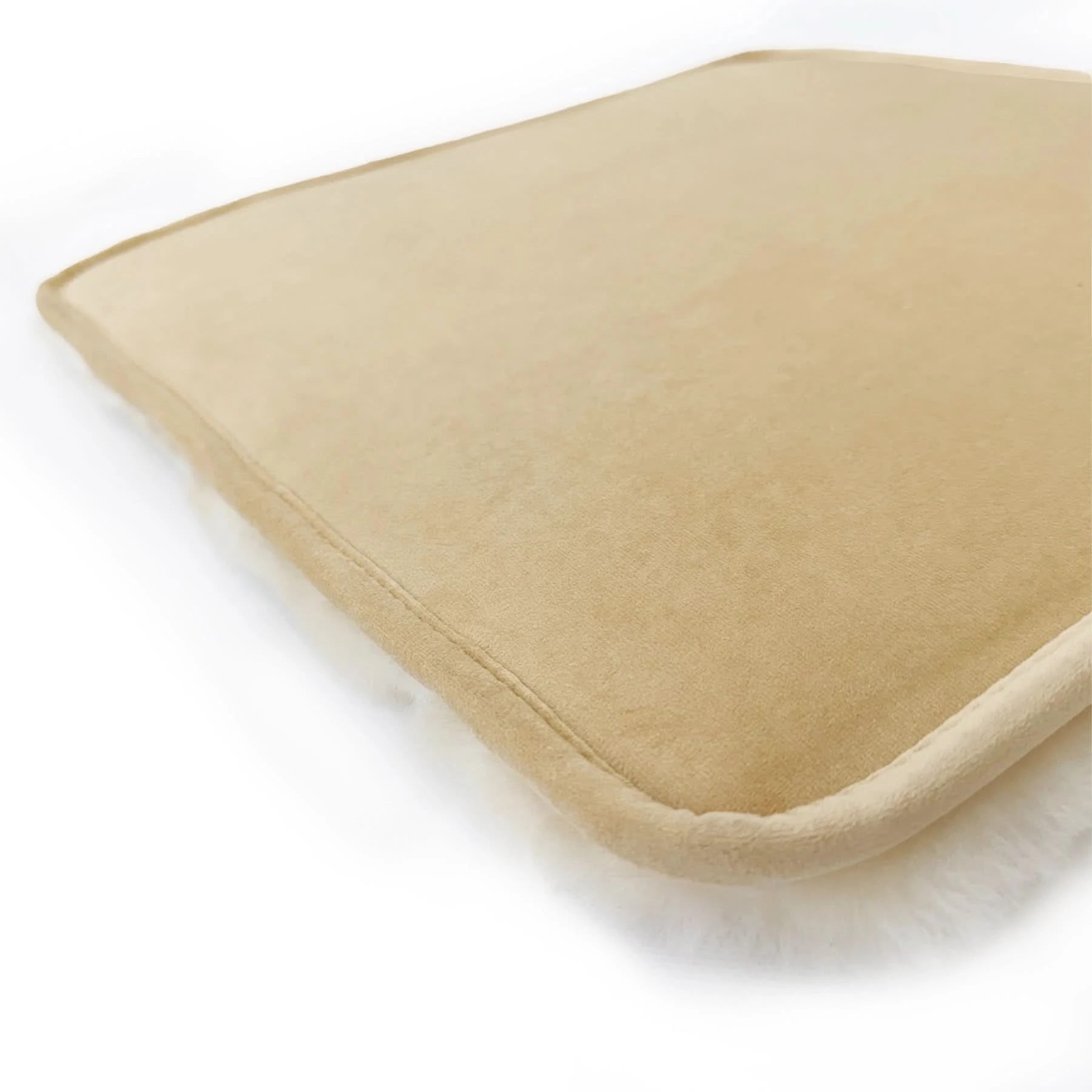 Beige sheepskin cushion cover with soft wool texture, angled side view. - Yellow Earth Australia