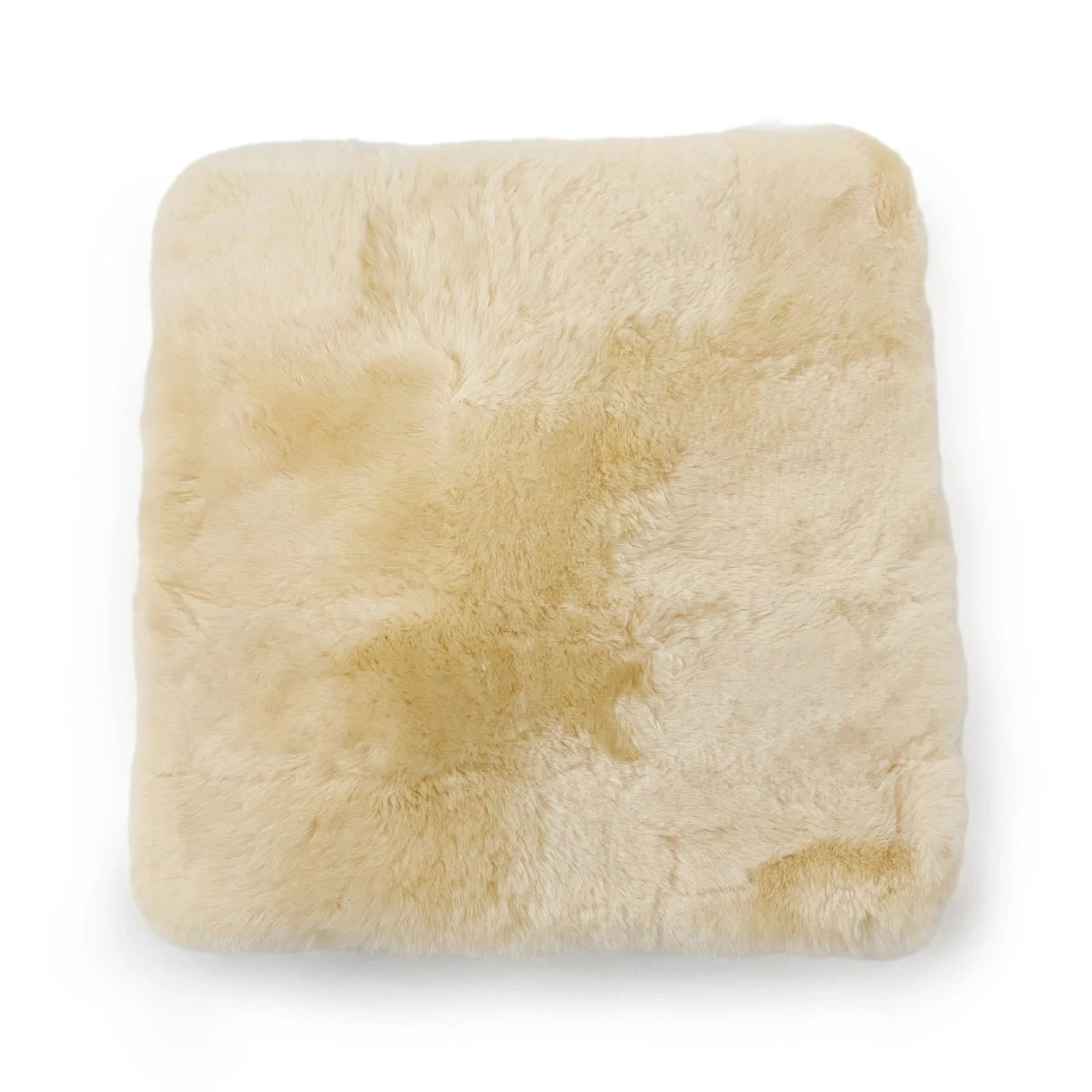 Cream sheepskin cushion cover with soft wool pile texture, top view. - Yellow Earth Australia