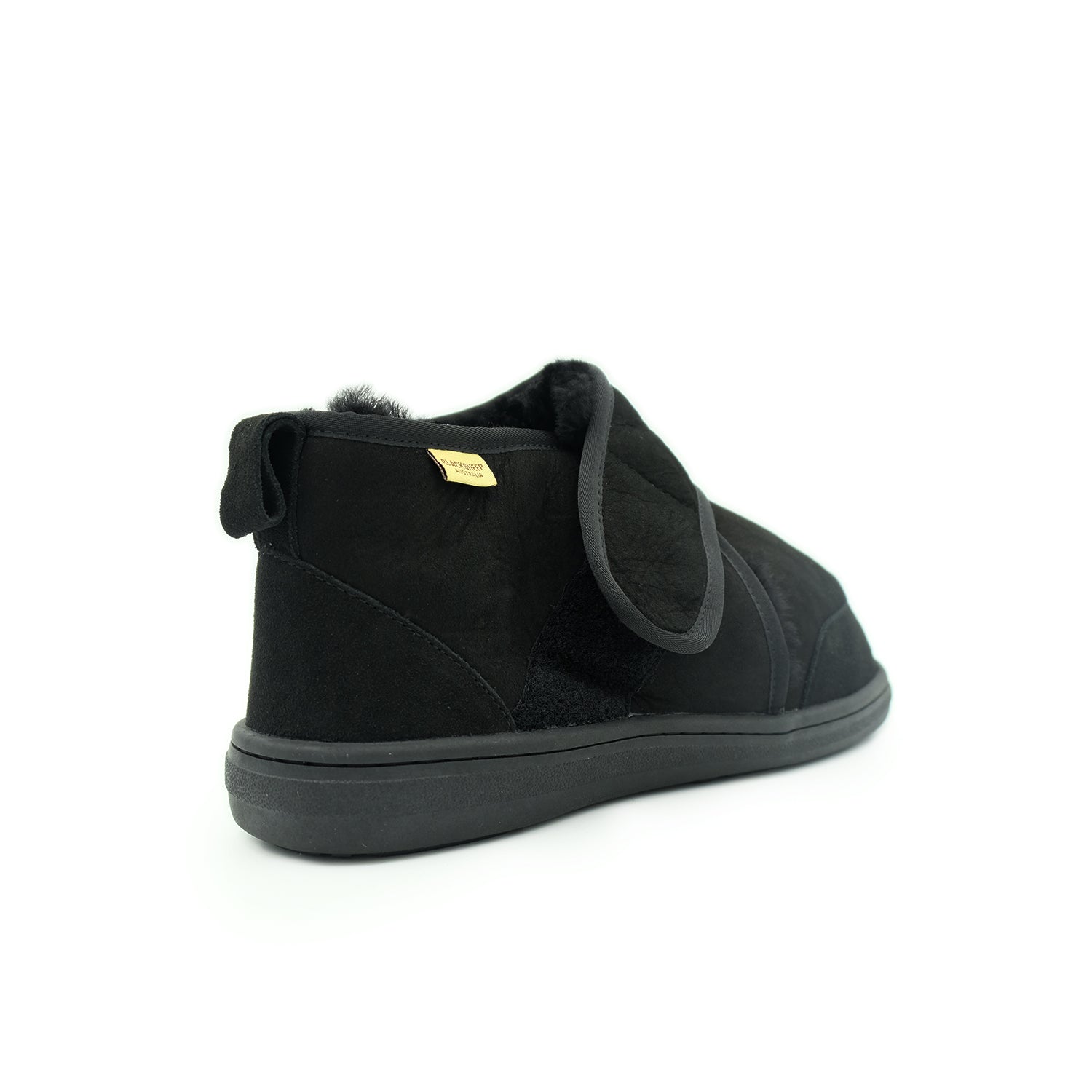 Black sheepskin ankle boot with fur trim, rear three-quarter view. - Yellow Earth Australia