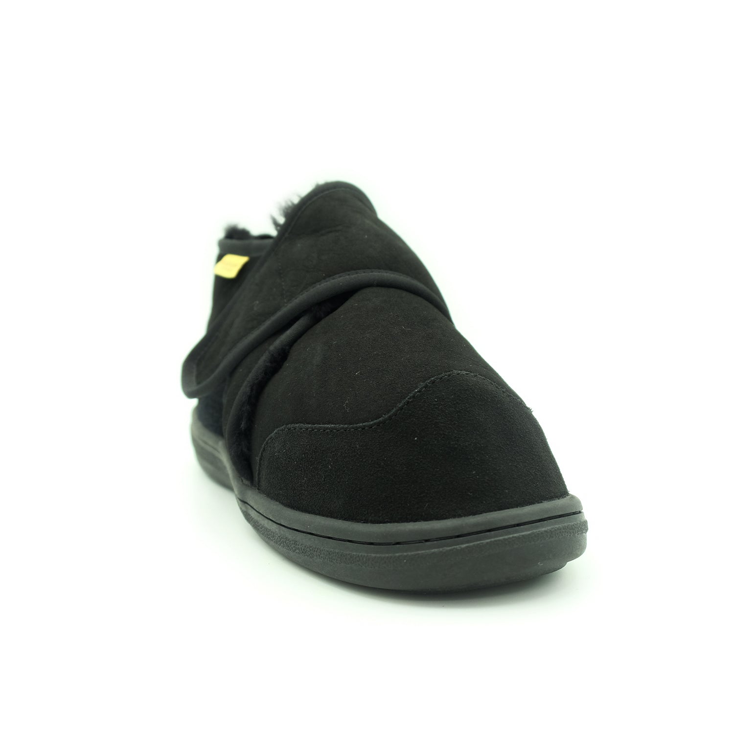 Black sheepskin slipper with wool lining, angled side view. - Yellow Earth Australia