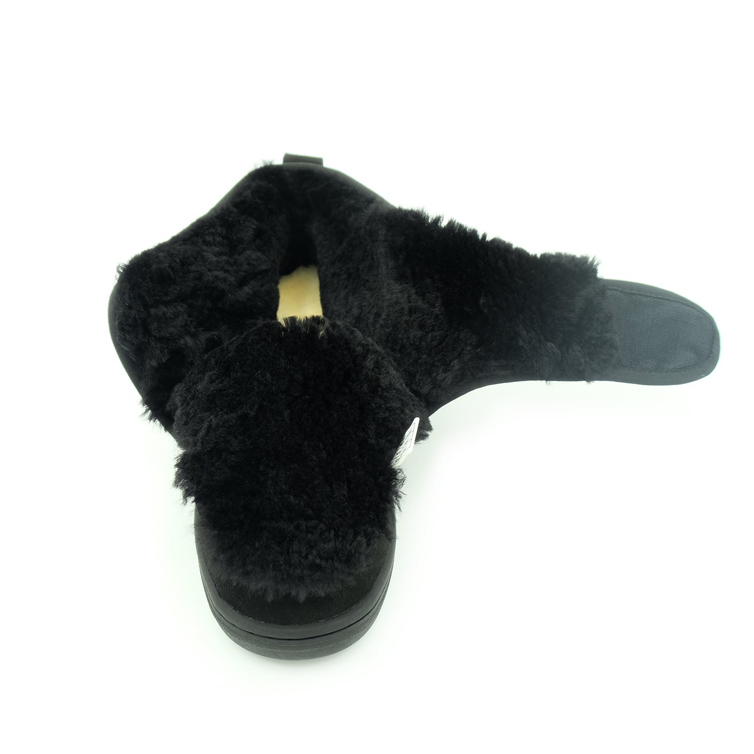 Black sheepskin slipper with wool lining, top view showing fluffy texture and sole. - Yellow Earth Australia