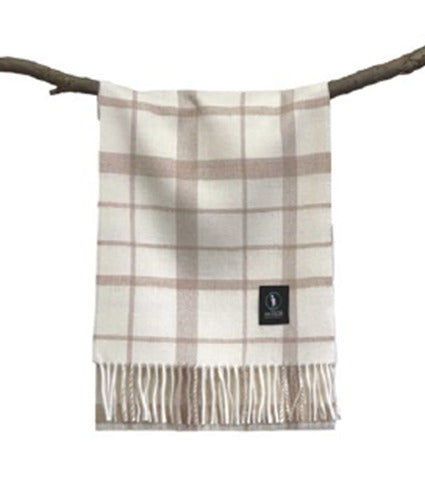 Cream and beige plaid wool throw blanket with fringe displayed on branch. - Yellow Earth Australia