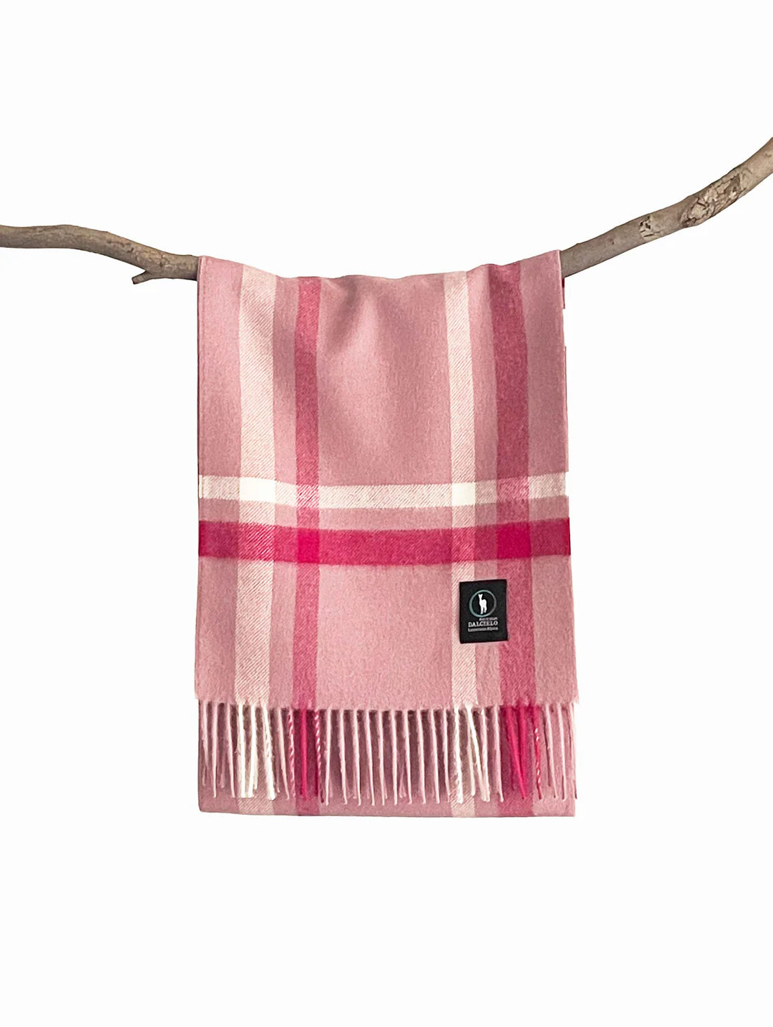 Pink check wool blanket with fringe draped over branch. - Yellow Earth Australia