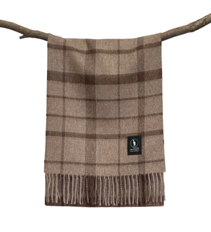 Taupe wool plaid blanket with fringe displayed on branch against white background. - Yellow Earth Australia