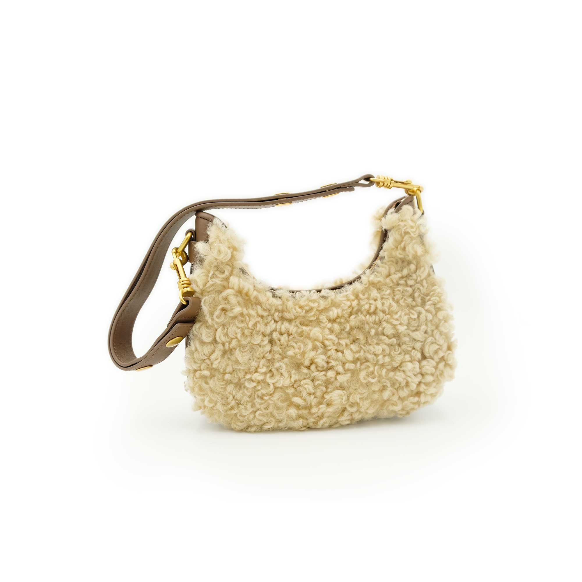 Cream sheepskin shoulder bag with curly wool texture and brown leather strap, side view. - Yellow Earth Australia