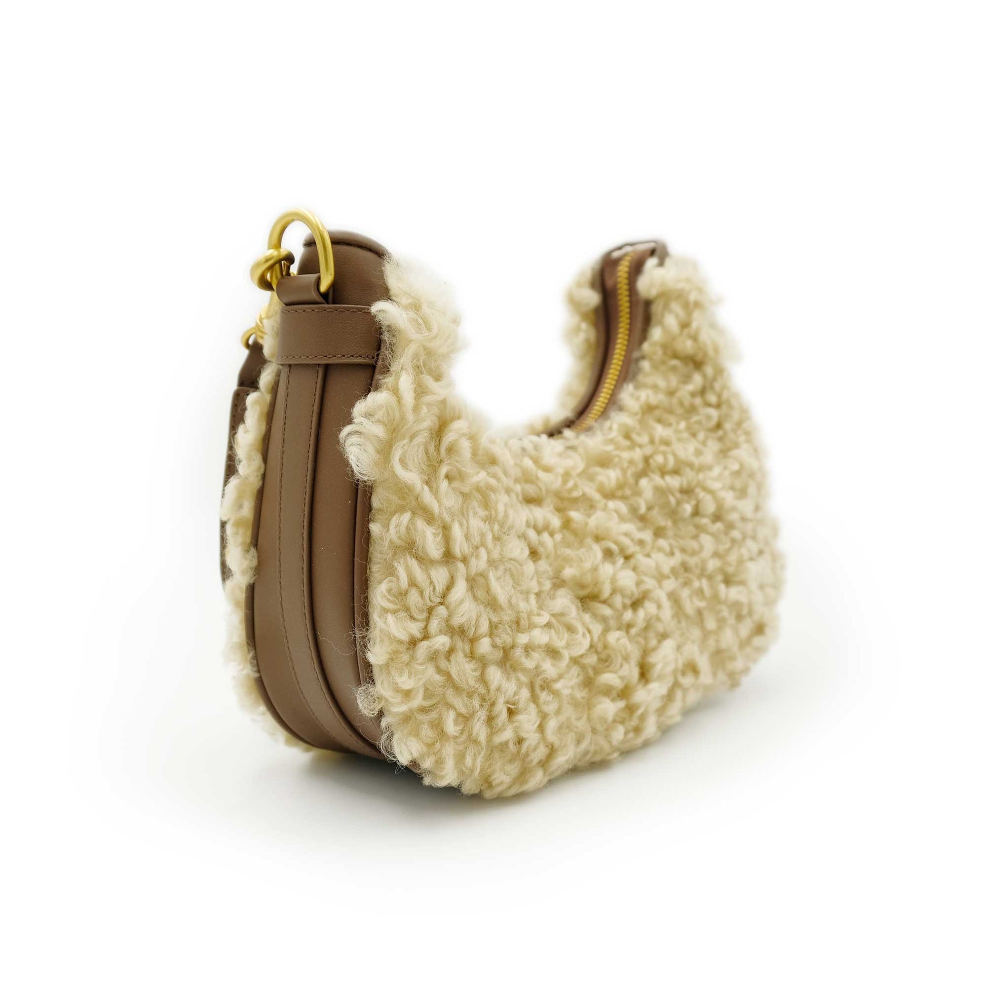 Cream sheepskin shoulder bag with tan leather trim, side view. - Yellow Earth Australia