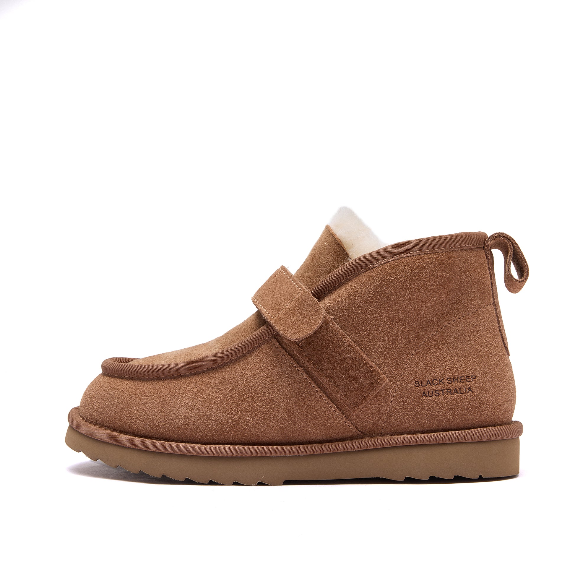 A single brown suede ankle boot with a hook-and-loop strap closure, a white shearling lining, and a brown sole, shown from a side profile on a white background. The brand name 'BLACK SHEEP AUSTRALIA' is printed on the side - Fleece Easy v2 Chestnut
