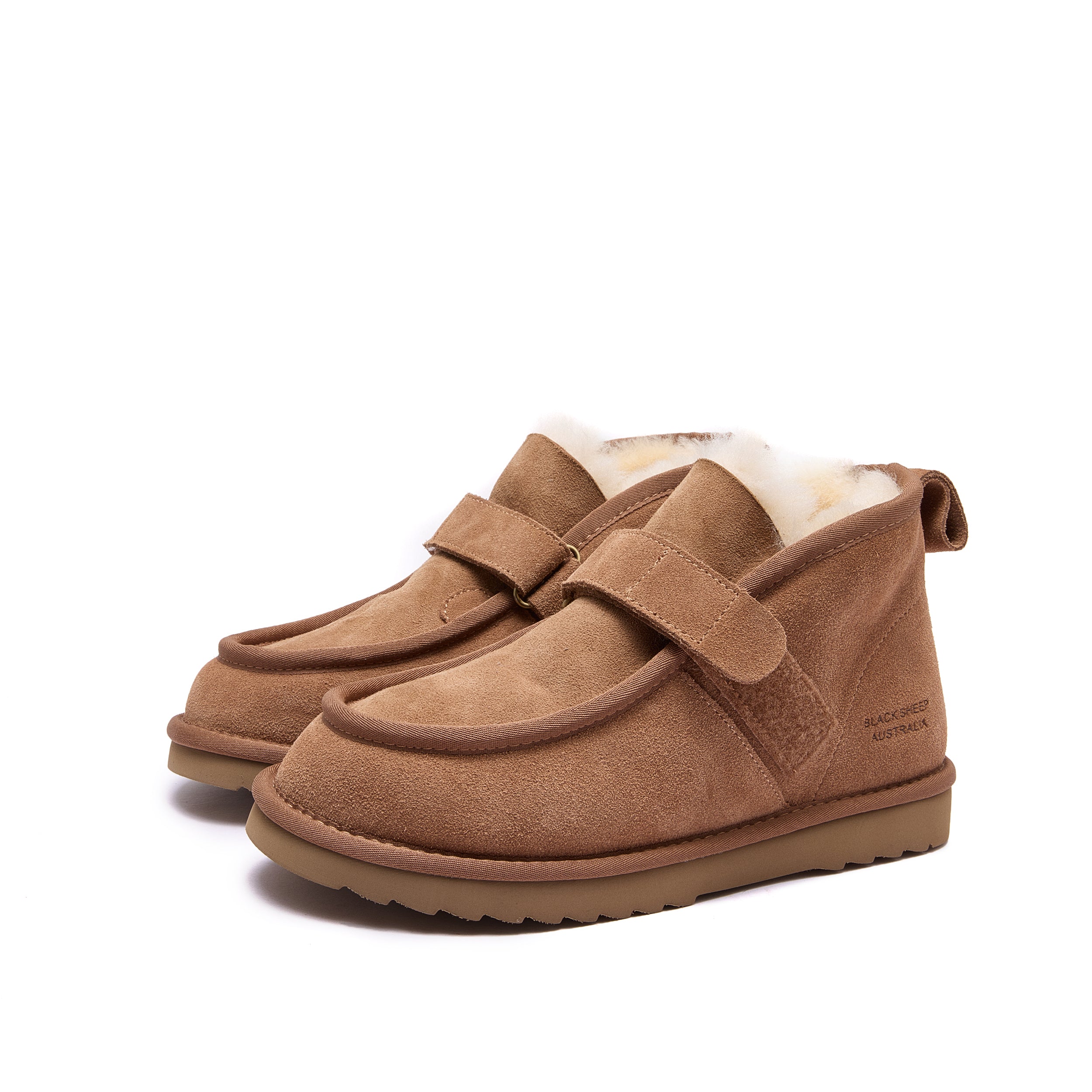 A pair of toddler slip-on ankle boots in brown suede with a white shearling lining, shown on a clean white background - Fleece Easy v2 Chestnut