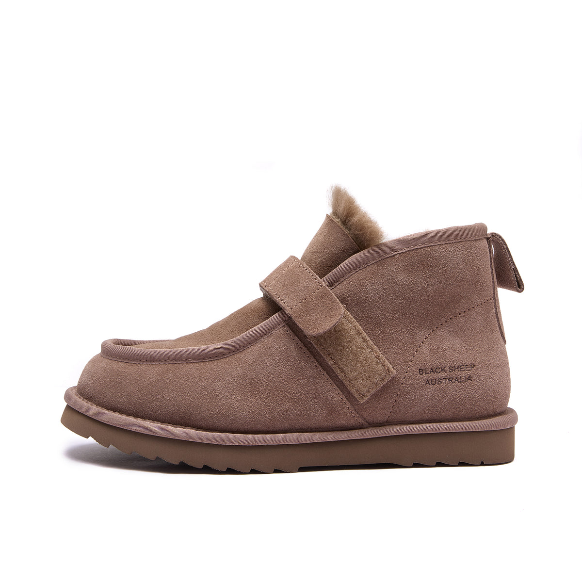 A single women's slip-on ankle boot in brown suede with a matching leather strap closure, a soft shearling-style collar, and a thick brown sole, shown on a plain white background - Fleece Easy v2 Mushroom