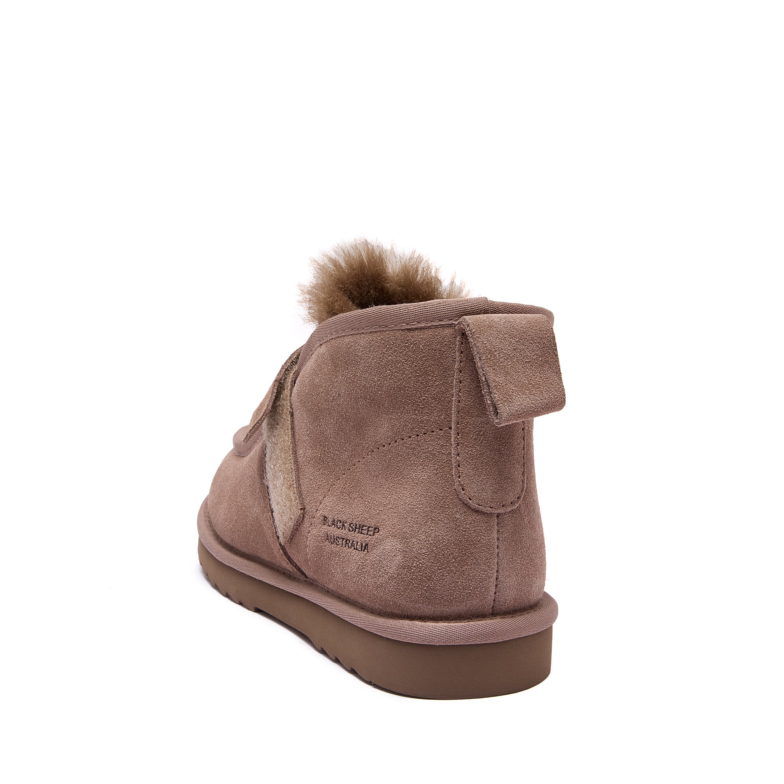 A single mid-calf ankle boot in taupe brown suede with a fluffy brown faux-fur trim at the top, shown from a rear three-quarter angle on a white background. The side of the heel features the text 'BLACK SHEEP AUSTRALIA' - Fleece Easy v2 Chestnut