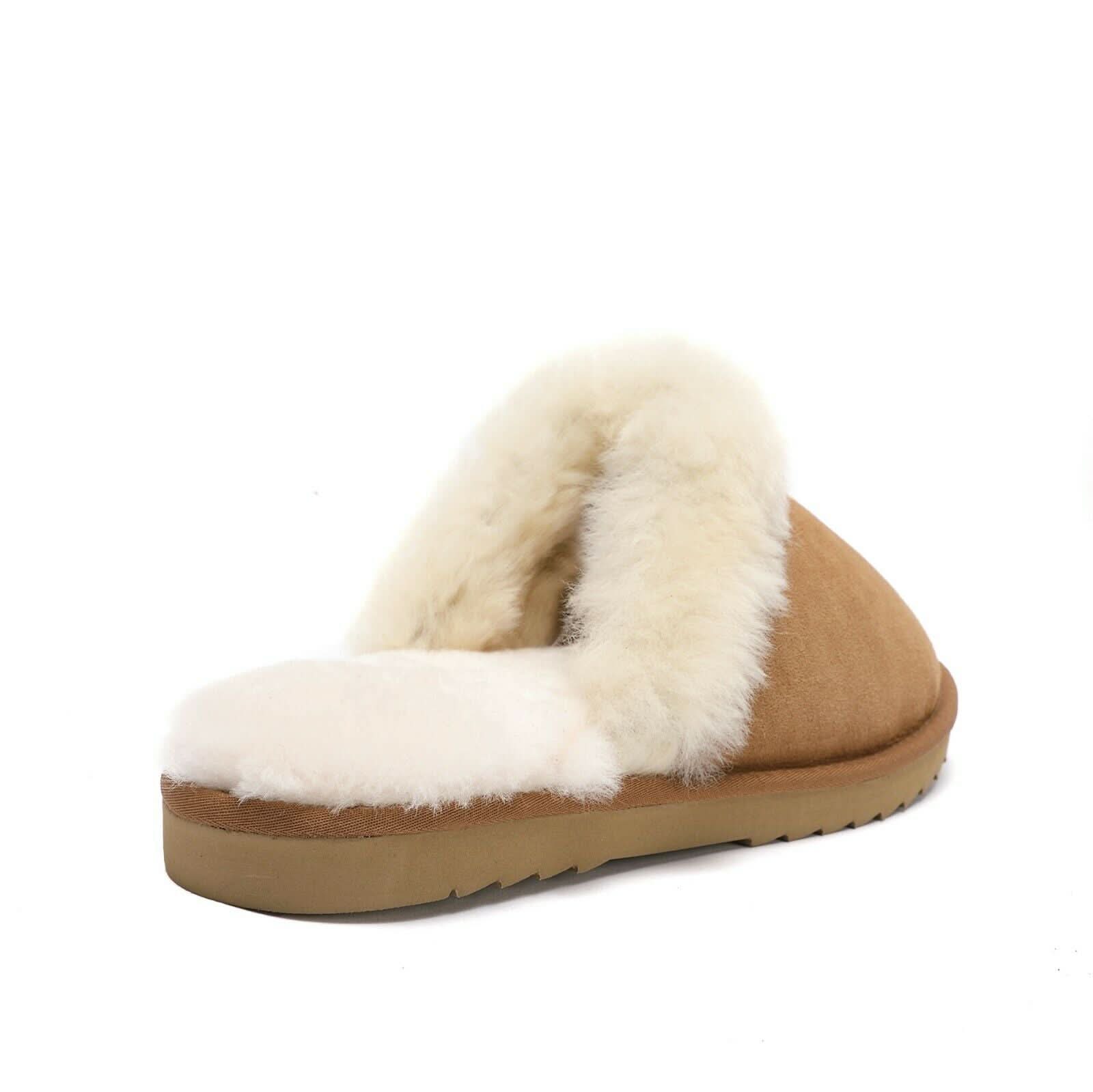 Brown sheepskin slipper with fluffy cream wool lining and sturdy sole on white background.