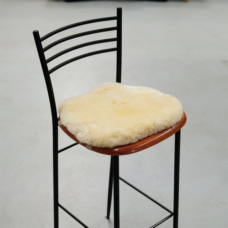 Chair Mat with Elastic Straps (or Motorcycle Seat Cover) - Ivory - Made From 100% Genuine Australian Merino Sheepskin displayed on a chair