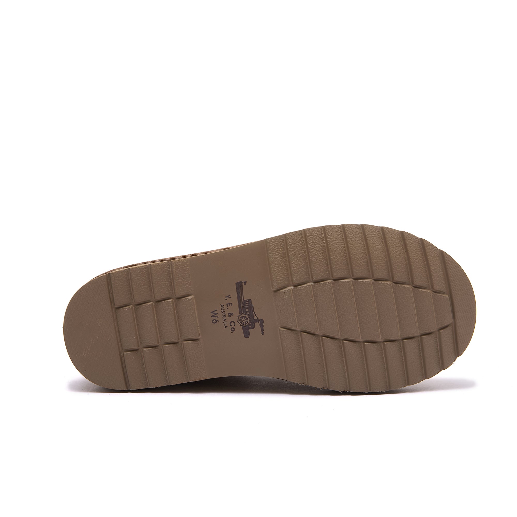 Tan leather shoe sole with treaded grip pattern, bottom view. - Yellow Earth Australia