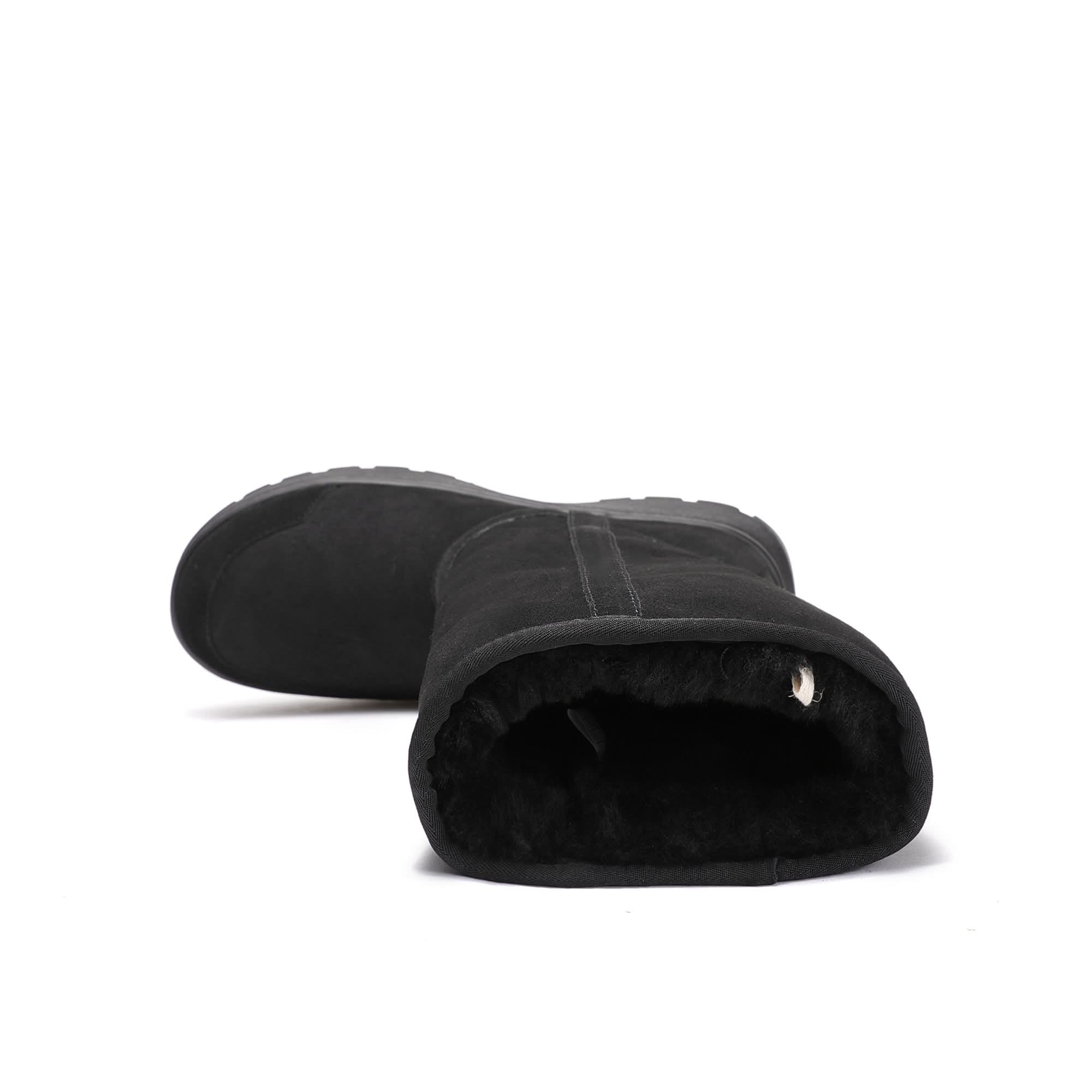 Black sheepskin boots with fluffy wool lining, front angled view. - Yellow Earth Australia